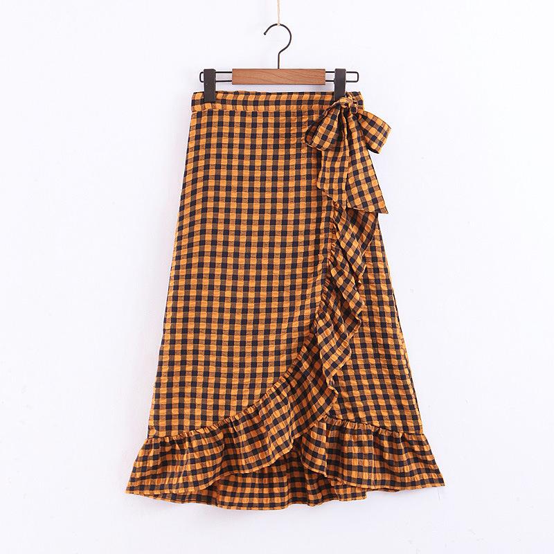 Elegant yellow plaid ruffle midi skirt featuring a high waist and bow detail, perfect for women's fashion.