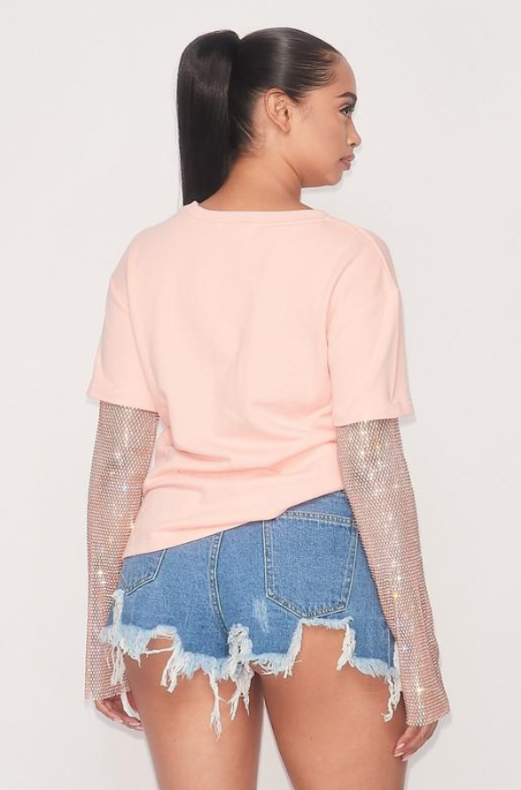 Elena Sequin Sleeve T-Shirt showcasing sparkling sequin details on the sleeves, made from soft 100% cotton fabric.