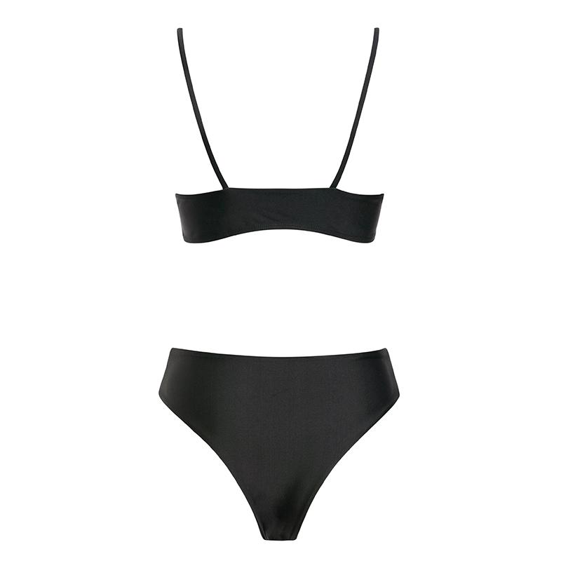 The Elena swimsuit featuring a bold two-piece design with mesh accents, showcasing a high waisted bottom and stylish buckles.