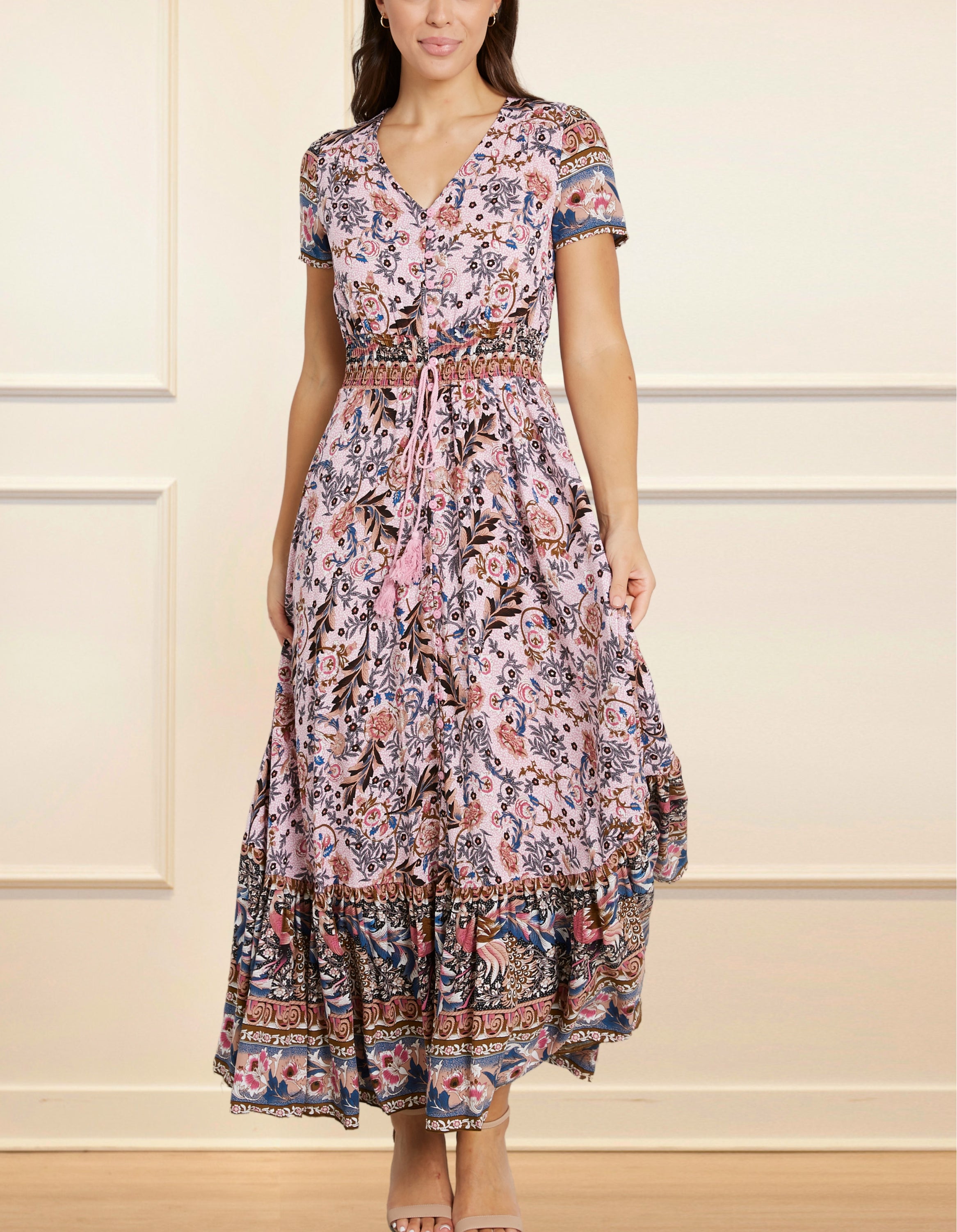 Elise Maxi Dress featuring a vintage floral bohemian print in pink and blue hues, with a V-neckline and short sleeves.