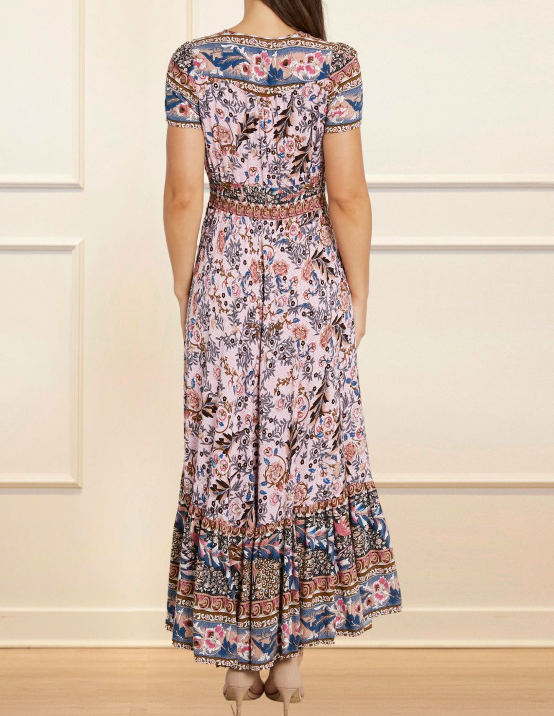 Elise Maxi Dress featuring a vintage floral bohemian print in pink and blue hues, with a V-neckline and short sleeves.