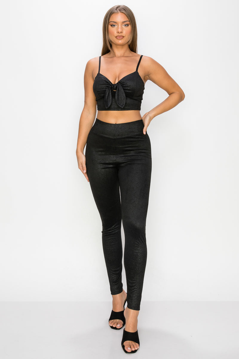 Embossed snake print crop top and leggings set featuring a front tie, sweetheart neckline, and high-rise waistband.