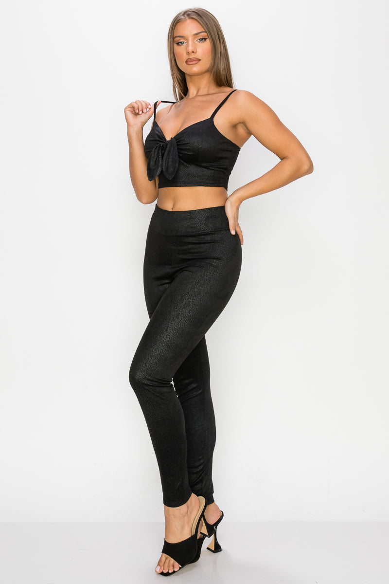 Embossed snake print crop top and leggings set featuring a front tie, sweetheart neckline, and high-rise waistband.