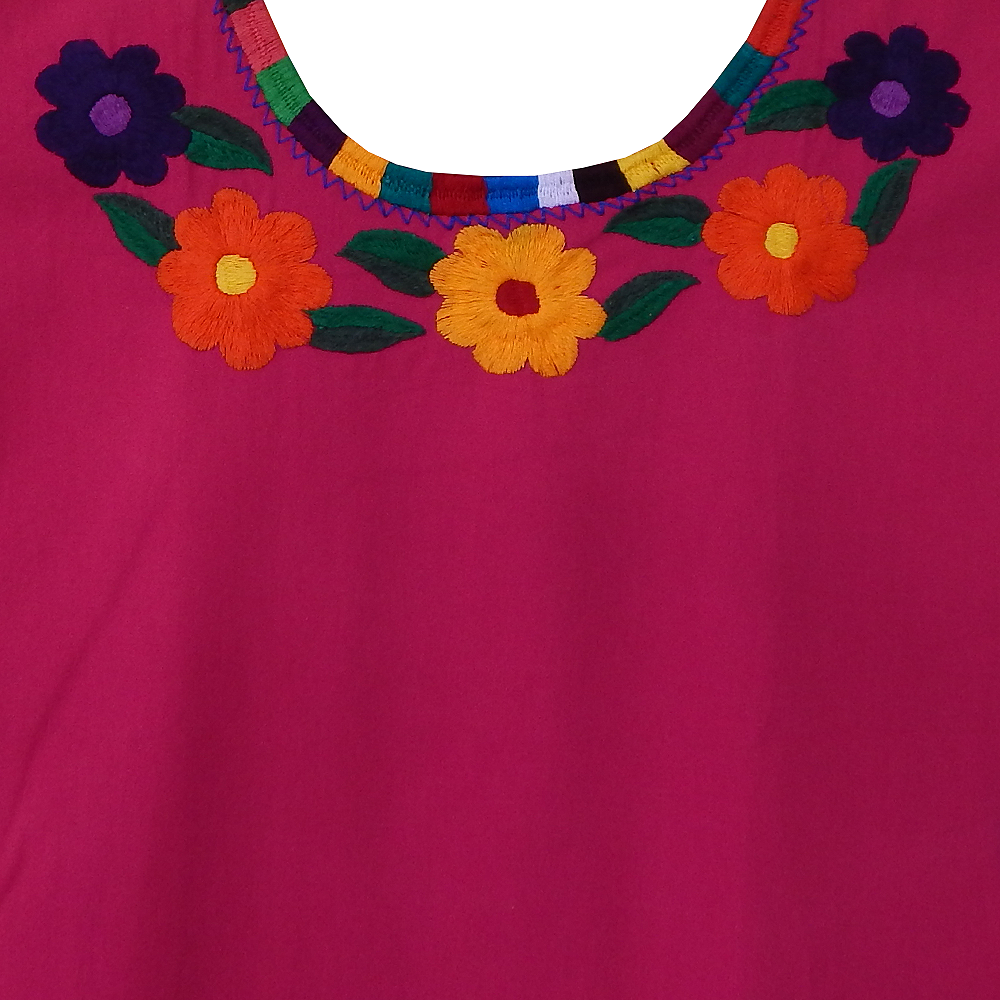 Embroidered blouse featuring colorful floral designs, handcrafted by Mexican artisans from Oaxaca, made of soft cotton fabric.