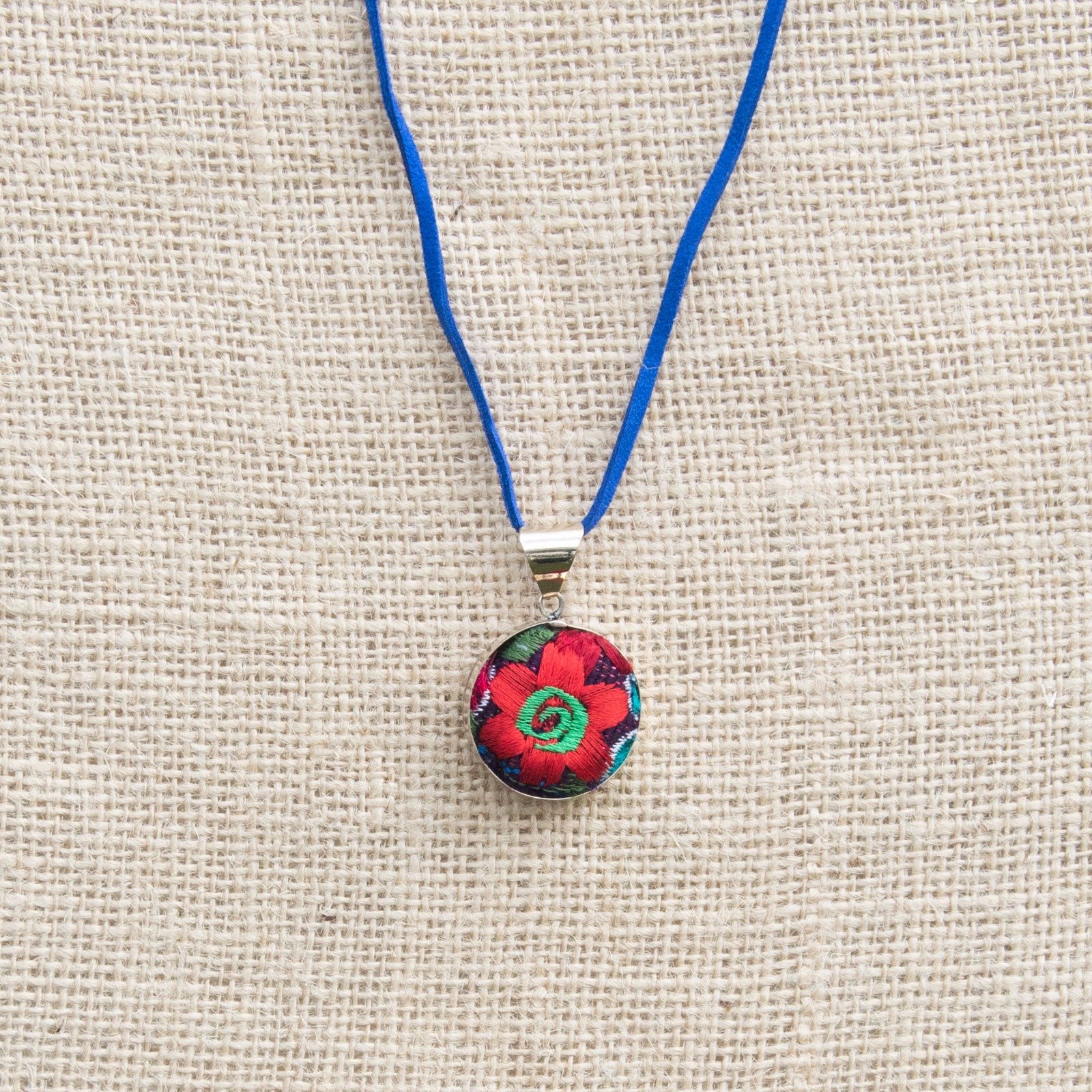 Embroidered Flower Boho Necklace featuring a vibrant floral textile pendant handcrafted in Chiapas, Mexico, showcasing intricate embroidery.