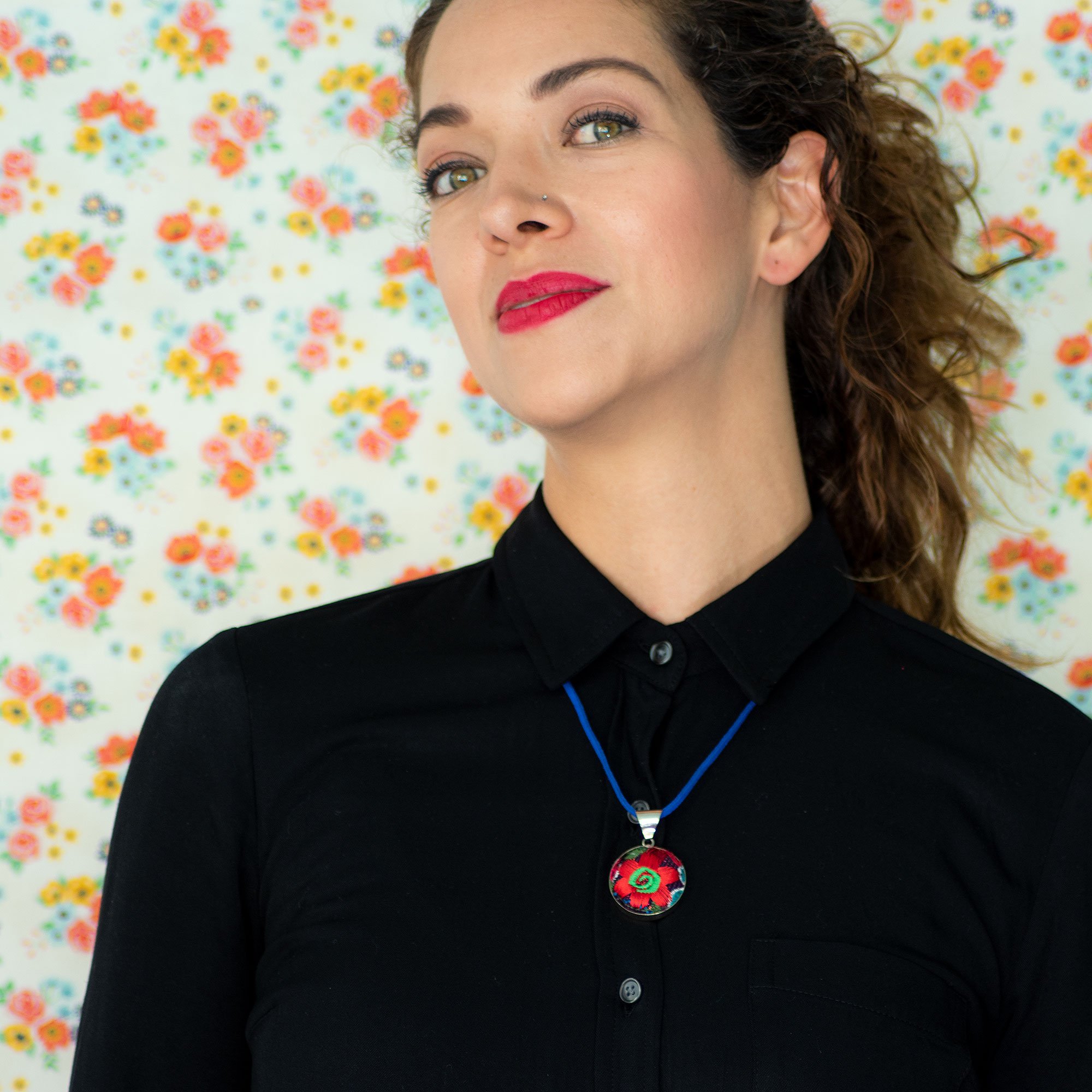 Embroidered Flower Boho Necklace featuring a vibrant floral textile pendant handcrafted in Chiapas, Mexico, showcasing intricate embroidery.