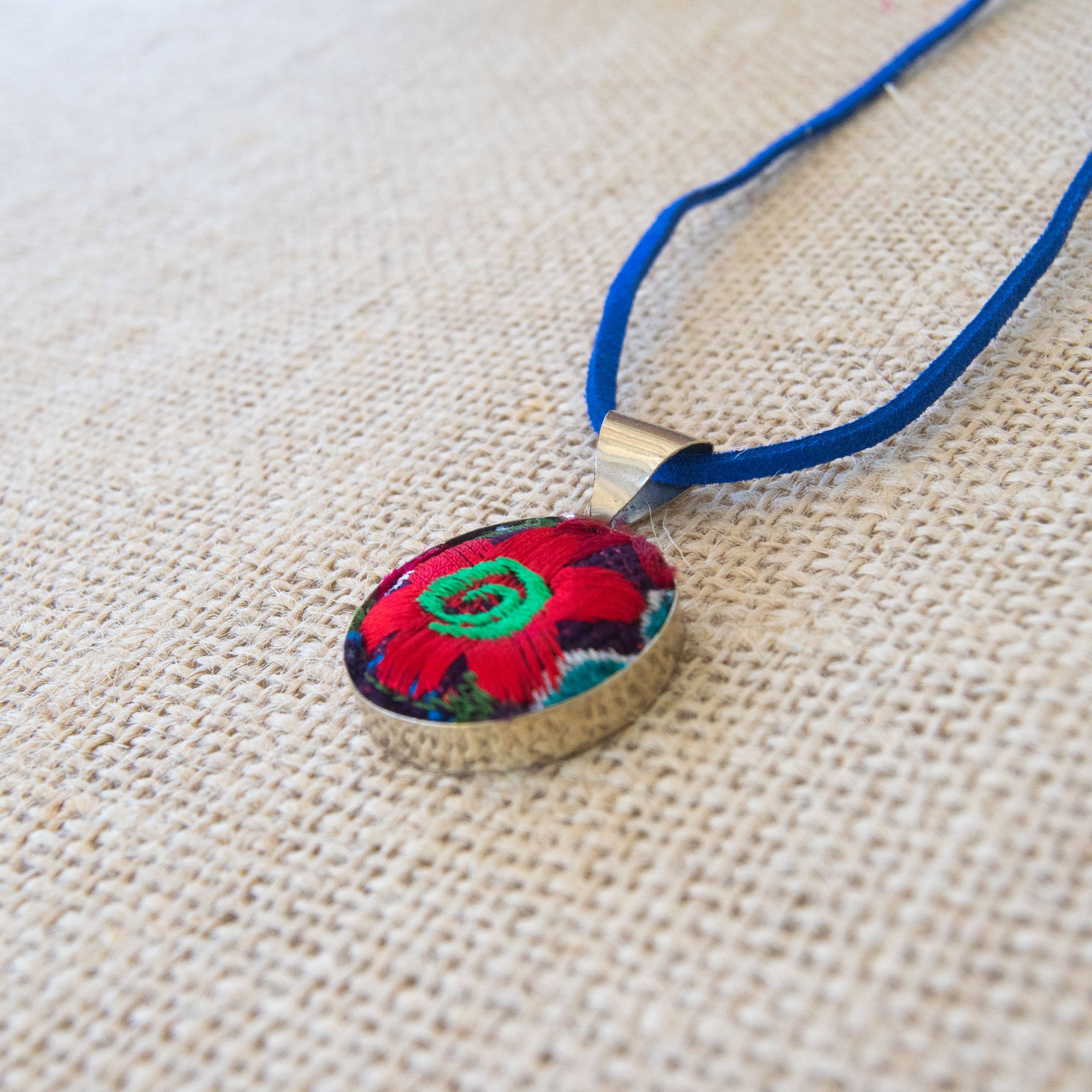 Embroidered Flower Boho Necklace featuring a vibrant floral textile pendant handcrafted in Chiapas, Mexico, showcasing intricate embroidery.