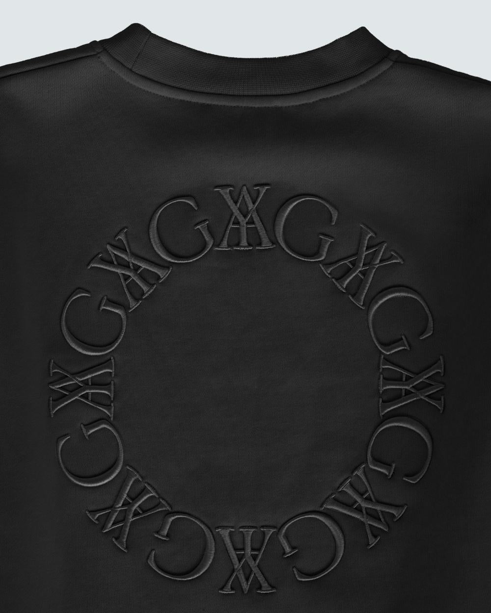 Black embroidered sweatshirt made from 100% organic cotton, featuring tonal embroidery and voluminous long sleeves.