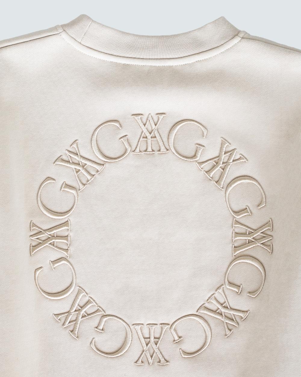 Embroidered Sweatshirt Tan made from 100% organic cotton, featuring tonal embroidery and long voluminous sleeves.