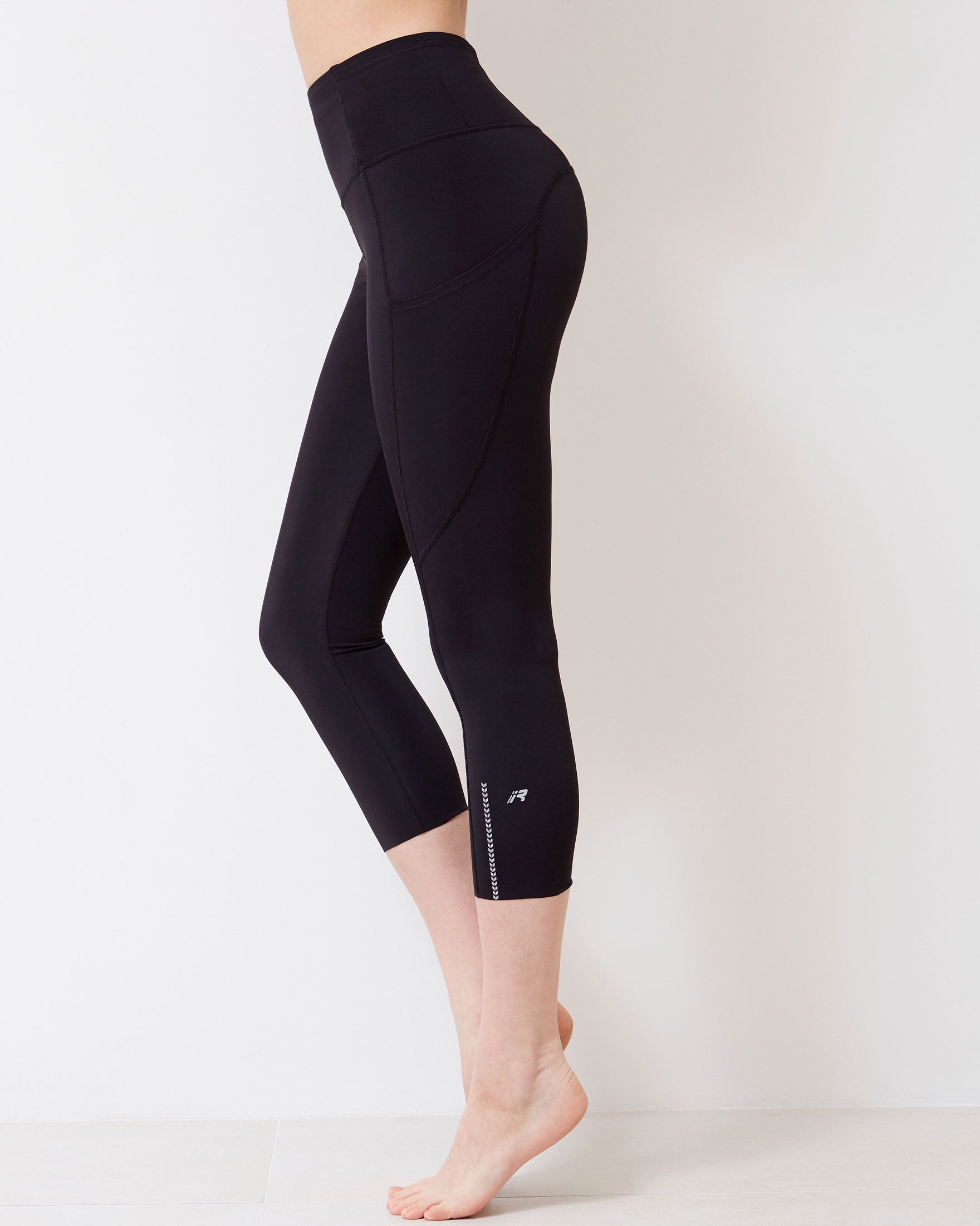 Energy Reflective Silkiflex™ Legging showcasing chevron reflective graphics and laser cut leg openings, perfect for activewear.