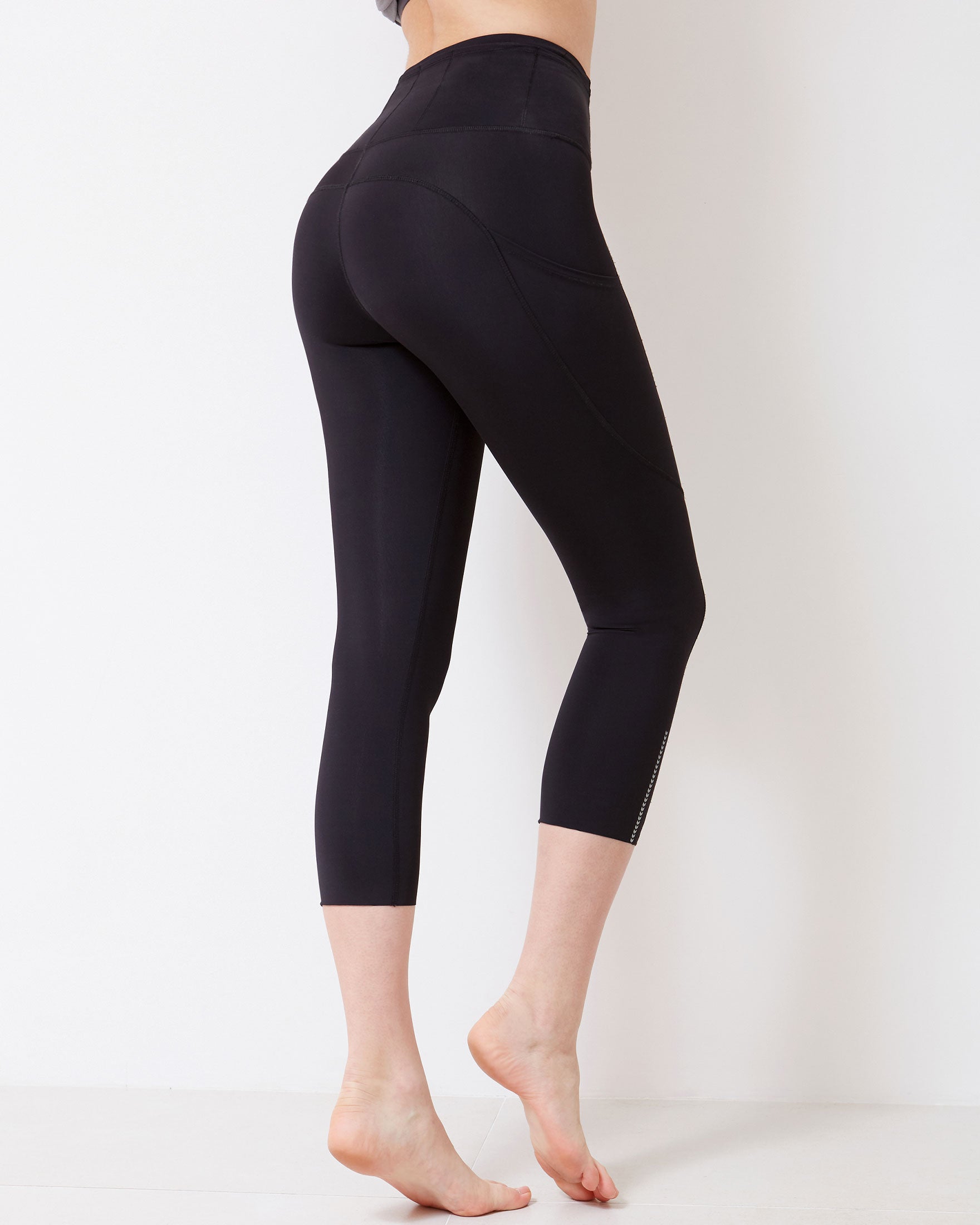 Energy Reflective Silkiflex™ Legging showcasing chevron reflective graphics and laser cut leg openings, perfect for activewear.