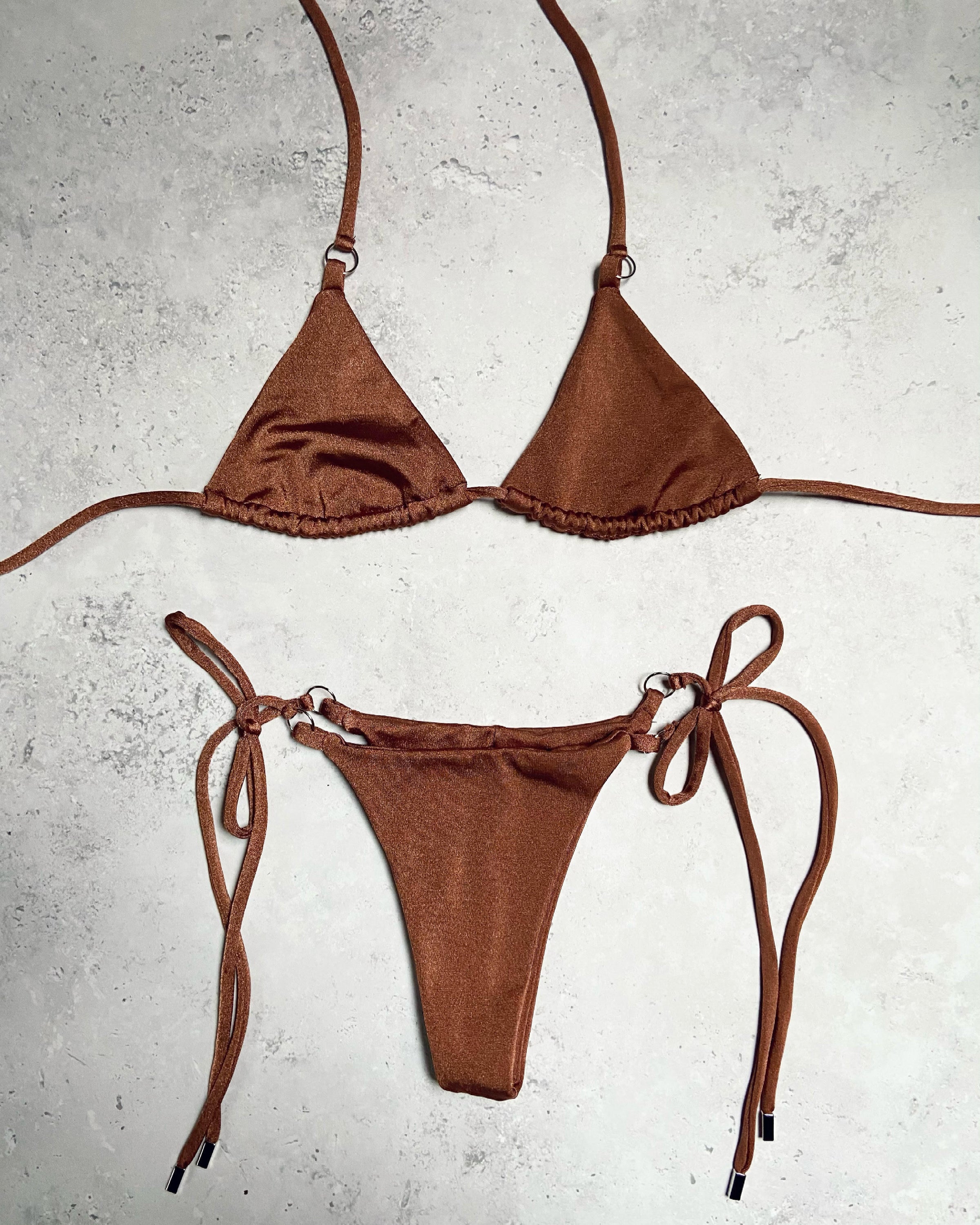 Essential Bottoms in Bronze Shimmer, showcasing a double-lined design with adjustable string tie, perfect for stylish swimwear.