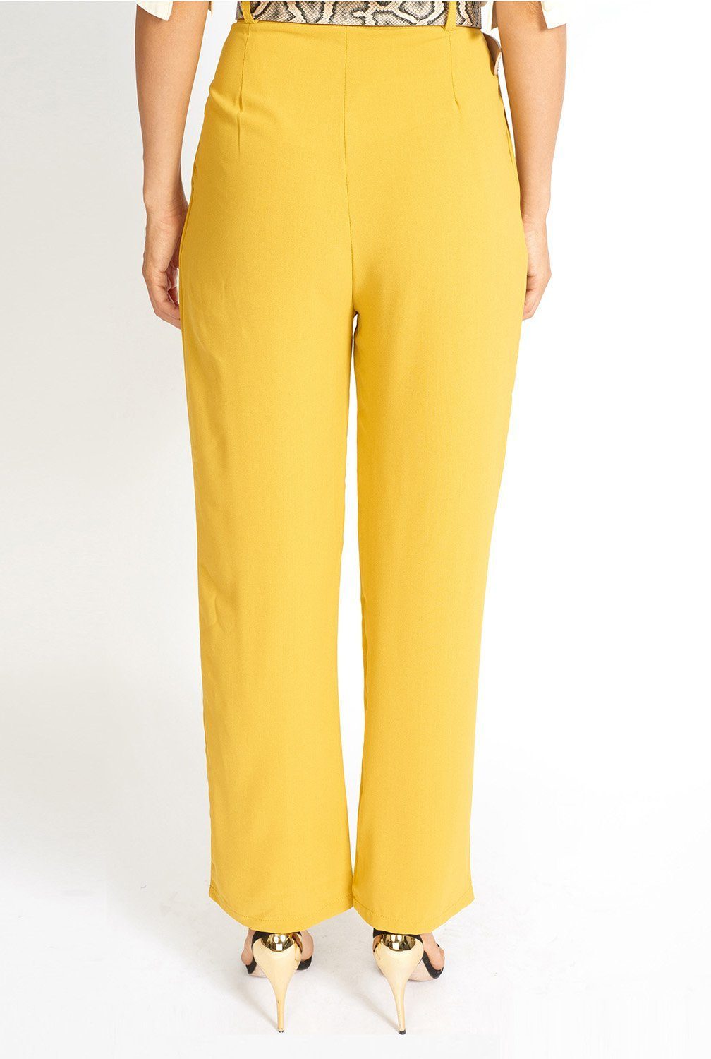 Essential High Waisted Suit Pants in a stylish setting, showcasing pleated detailing and side pockets.