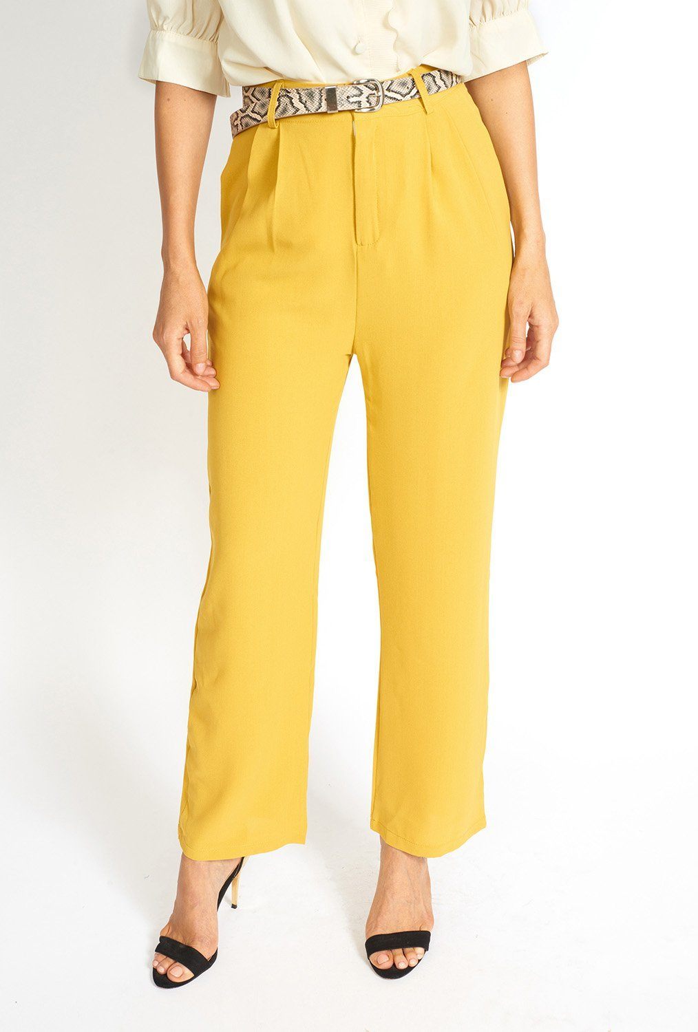 Essential High Waisted Suit Pants in a stylish setting, showcasing pleated detailing and side pockets.