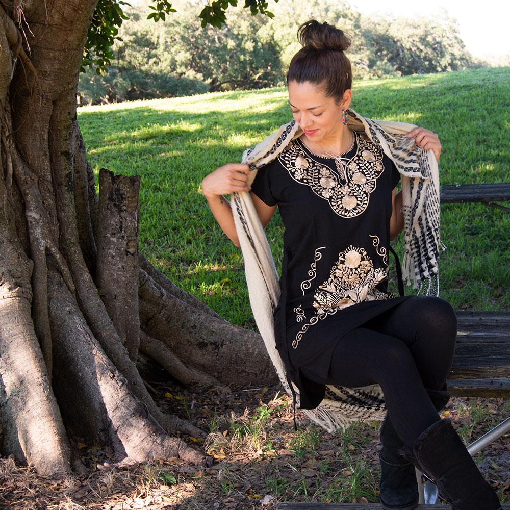 A beautiful Ethnic Folk Golden Embroidered Mexican Dress featuring intricate golden floral embroidery, showcasing its unique artisan craftsmanship.