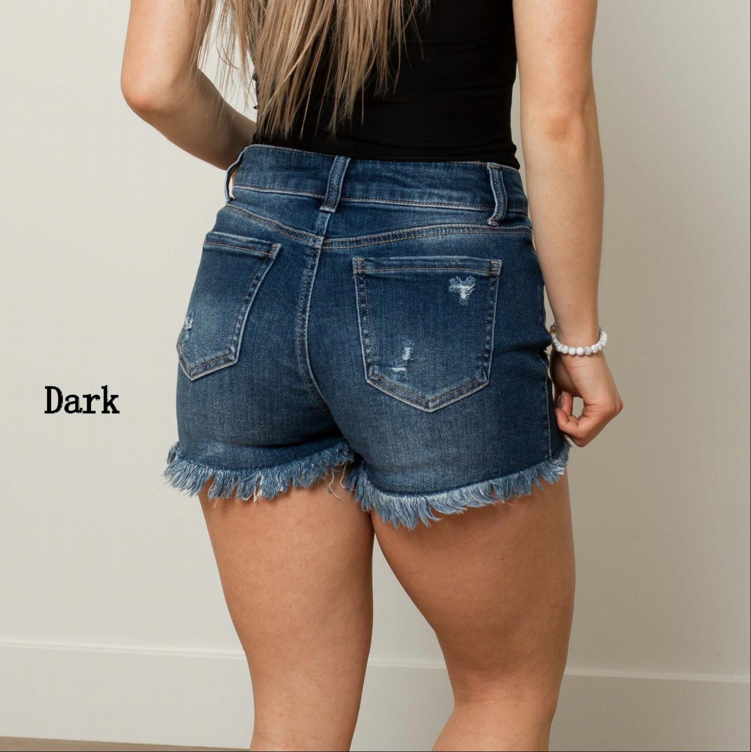 A pair of stylish Exposed Button Frayed Hem Shorts featuring a distressed design and button fly, perfect for summer wear.