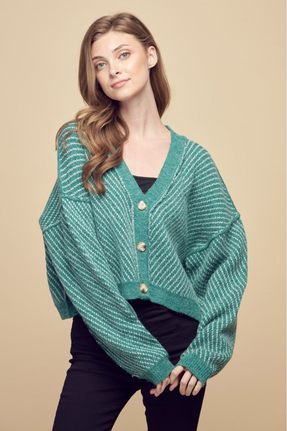 Exposed Seam Drop Shoulder Cardigan in striped pattern, featuring buttoned front and dropped shoulder sleeves, perfect for casual wear.