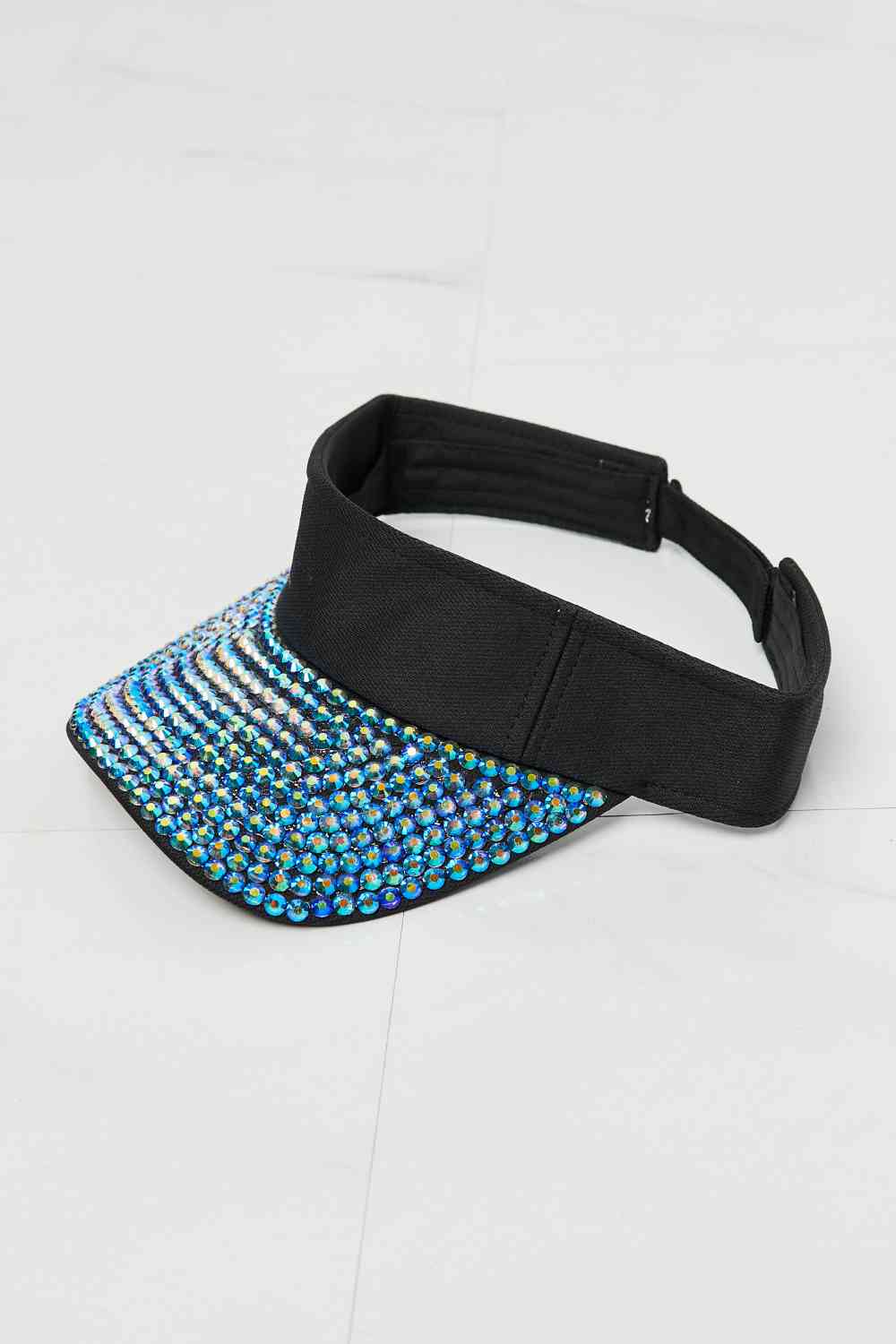 Fame Make It Sparkle Visor Hat with rhinestone rim, black color, adjustable strap, perfect for outdoor fashion.