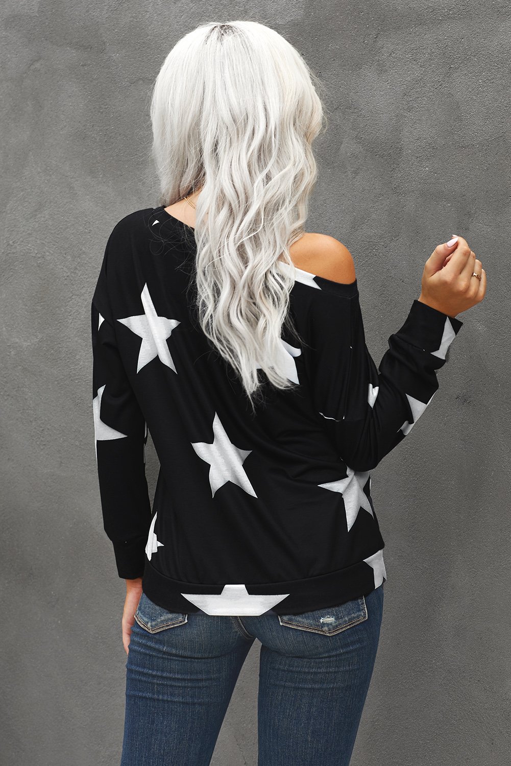 Fashionable black sweatshirt with a five-pointed star print, featuring a round neck and relaxed fit, suitable for modern ladies and teenagers.