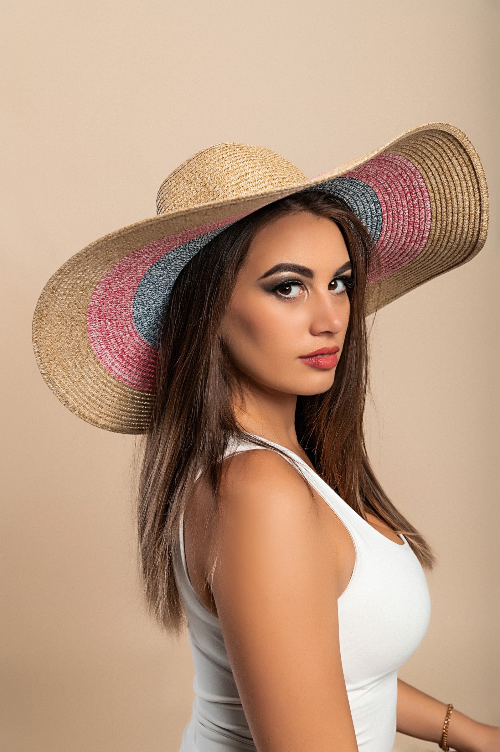 A stylish multicolor fashion hat with a round shape, perfect for various outfits and occasions.