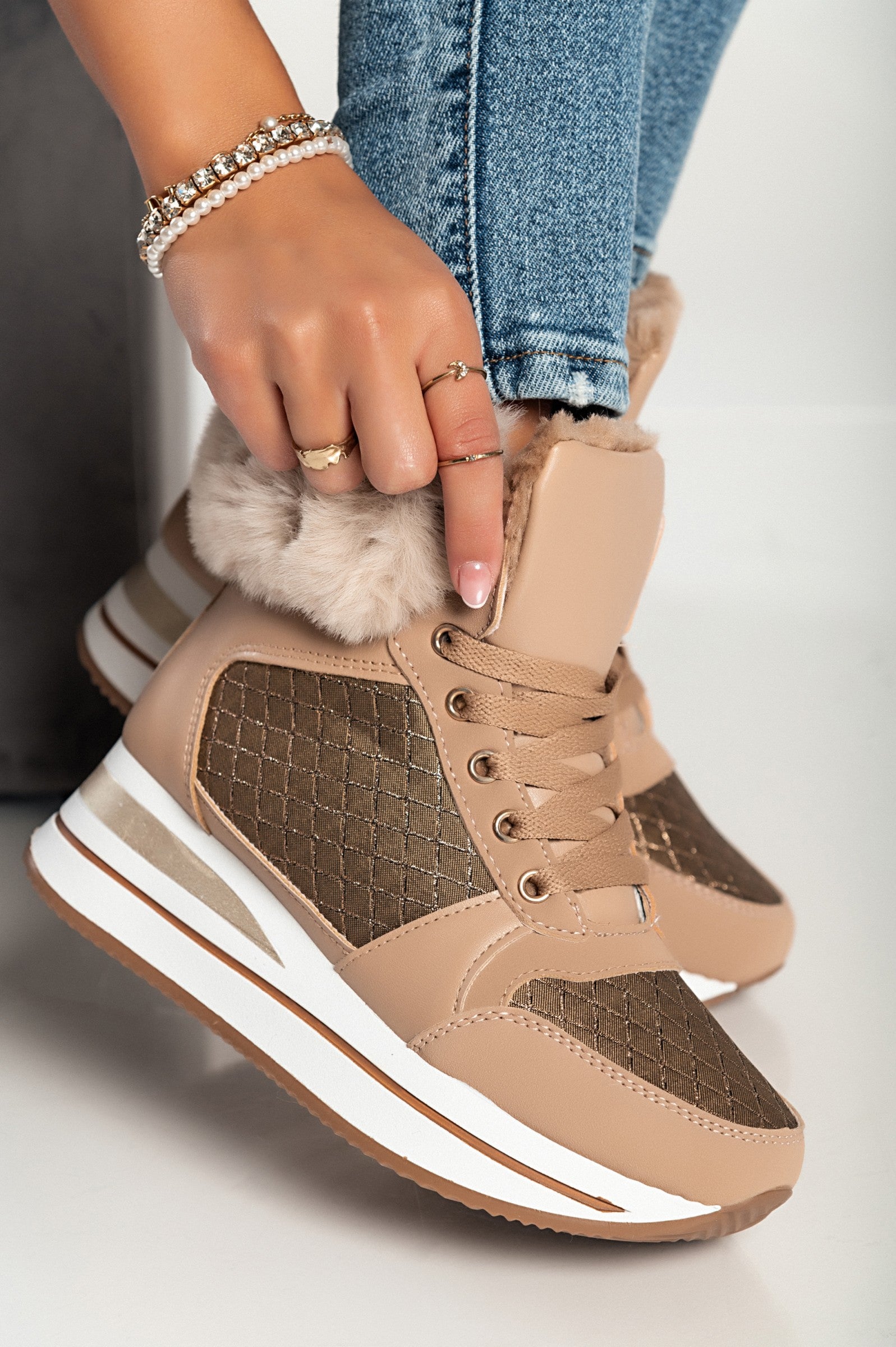 Camel fashion sneakers made of faux leather and textile, featuring a raised sole, round toe, and synthetic fur around the ankle.