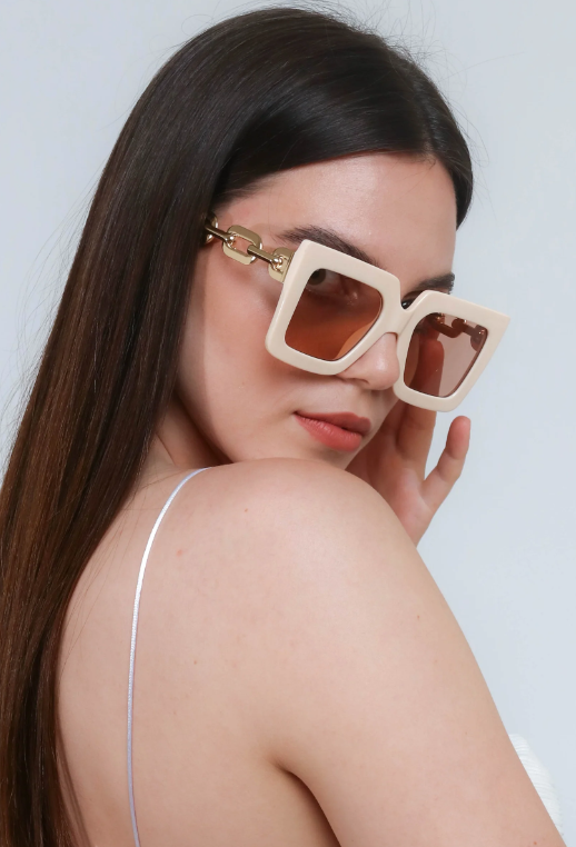 Beige fashion sunglasses with a rectangular frame, showcasing UV400 protection and scratch-resistant lenses.