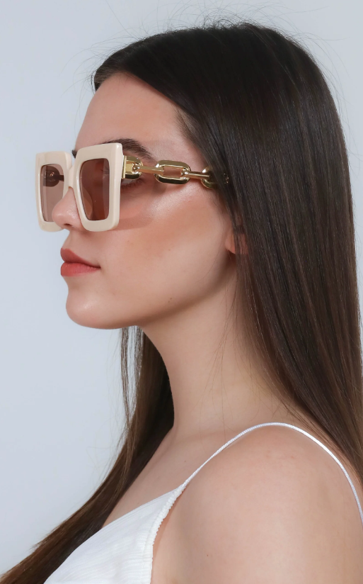 Beige fashion sunglasses with a rectangular frame, showcasing UV400 protection and scratch-resistant lenses.