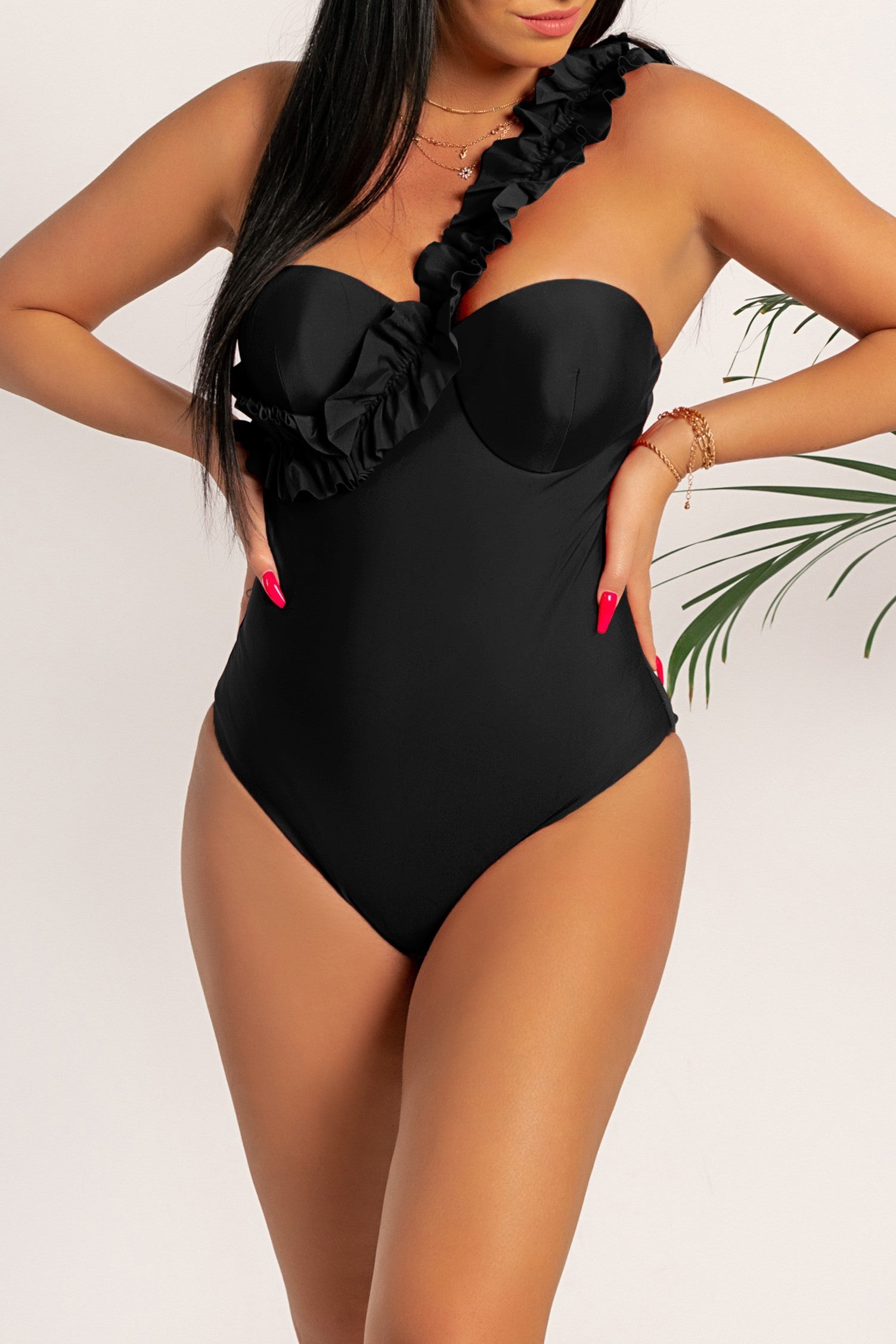 Fashionable black one-piece swimsuit with one strap and ruffle details, designed to enhance curves and provide comfort.