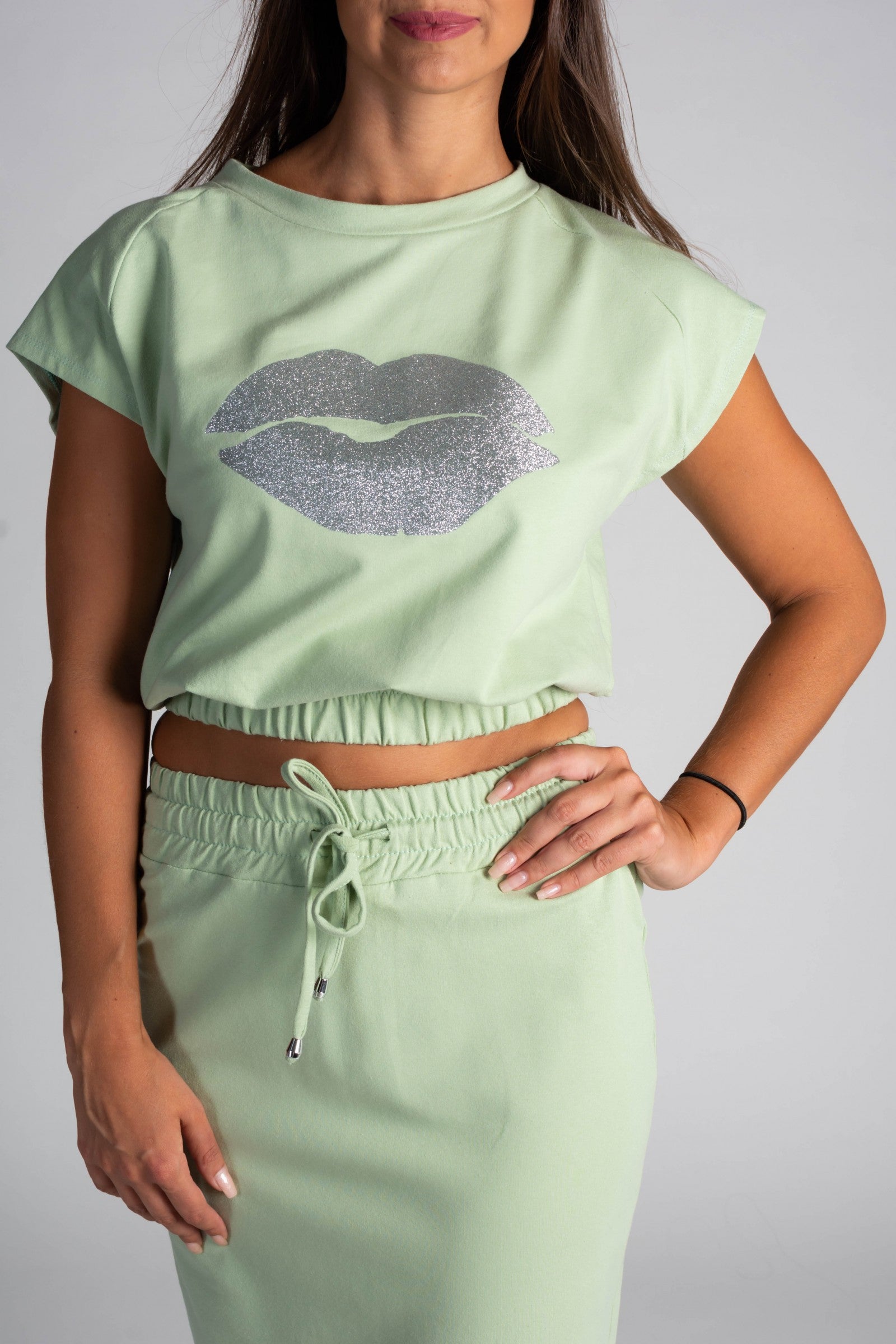 Fashionable mint cropped T-shirt with print and midi skirt set, showcasing a stylish design and comfortable fit.