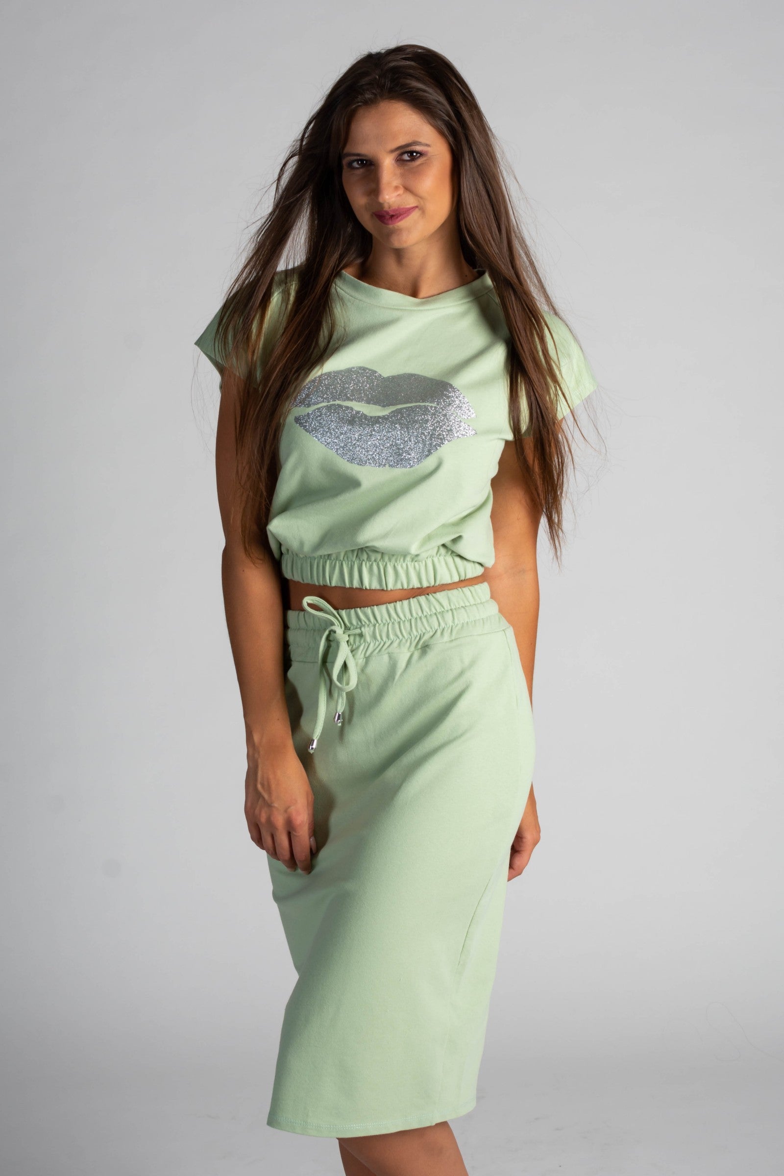 Fashionable mint cropped T-shirt with print and midi skirt set, showcasing a stylish design and comfortable fit.