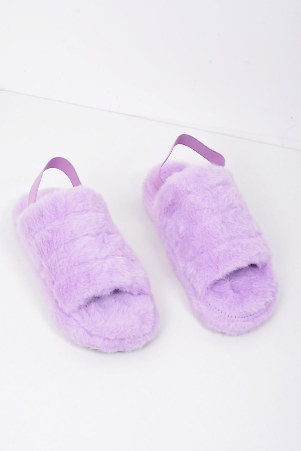 Cozy Faux Fur Fluffy Stripe Slippers with a heel strap, featuring a stylish stripe design in soft faux fur.