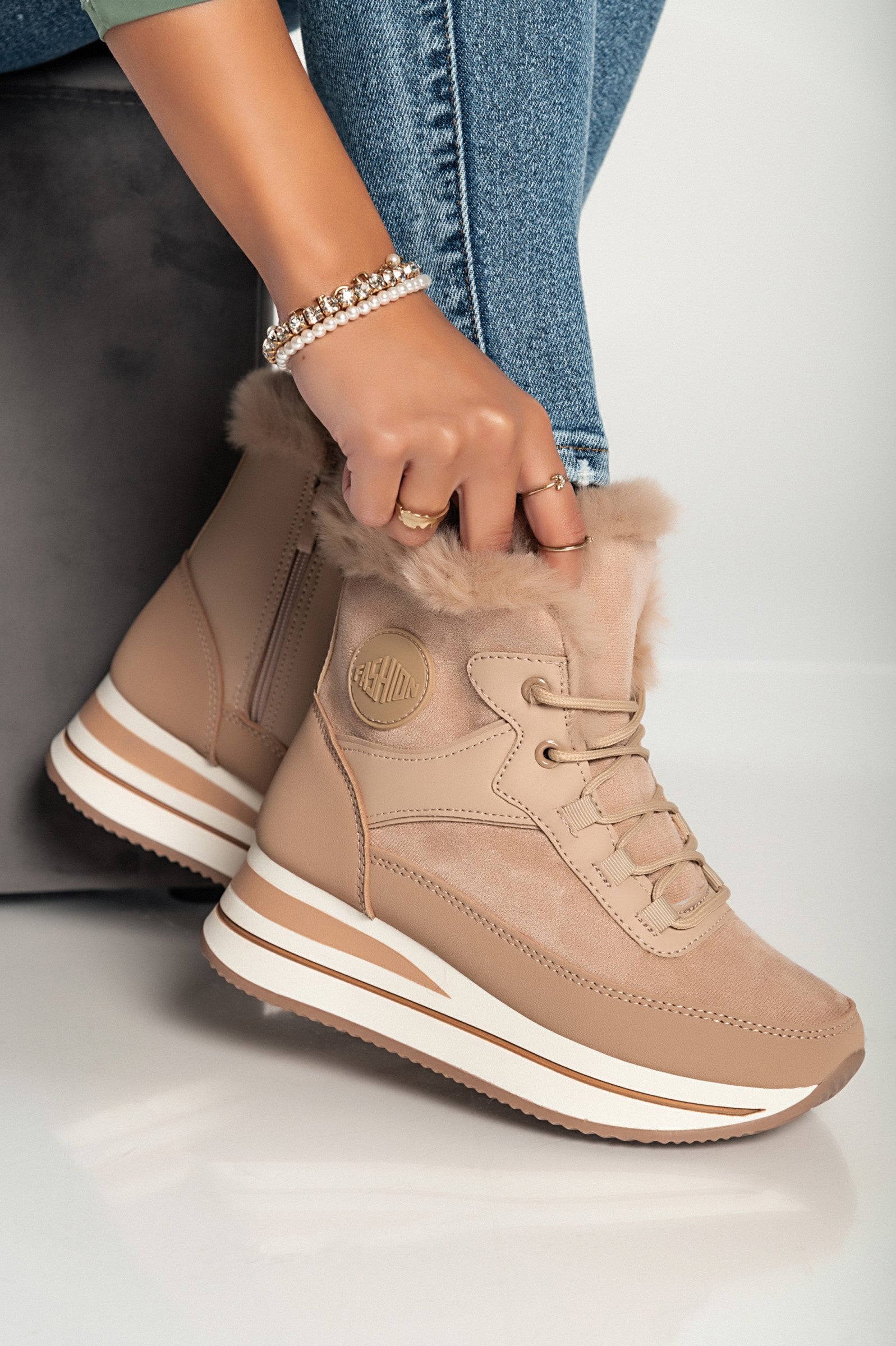 Khaki faux leather and textile fashion sneakers with raised sole and synthetic fur around the ankle.