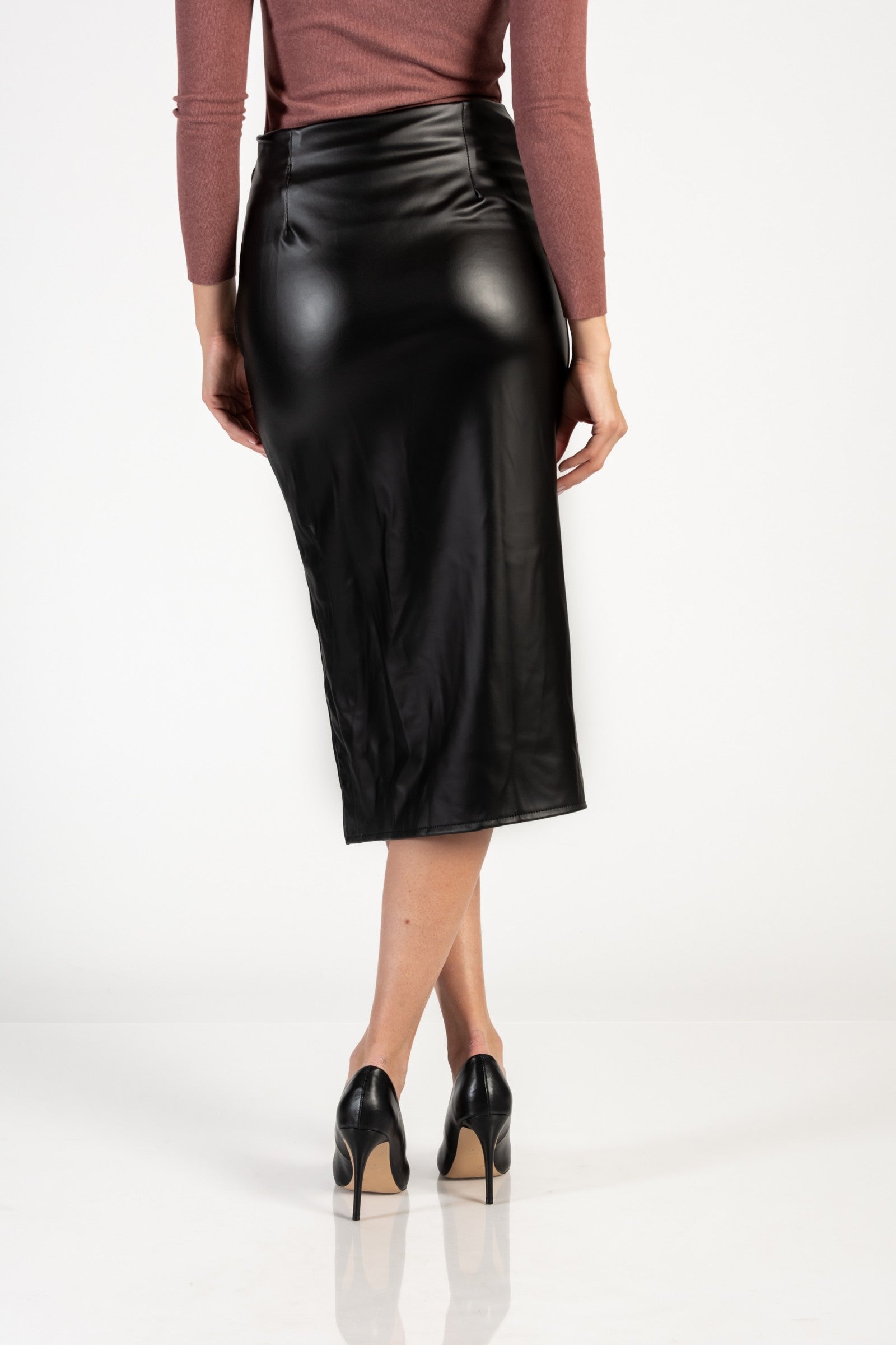 Elegant black faux leather midi skirt with high waist and side opening, showcasing gathered fabric and metal zipper closure.