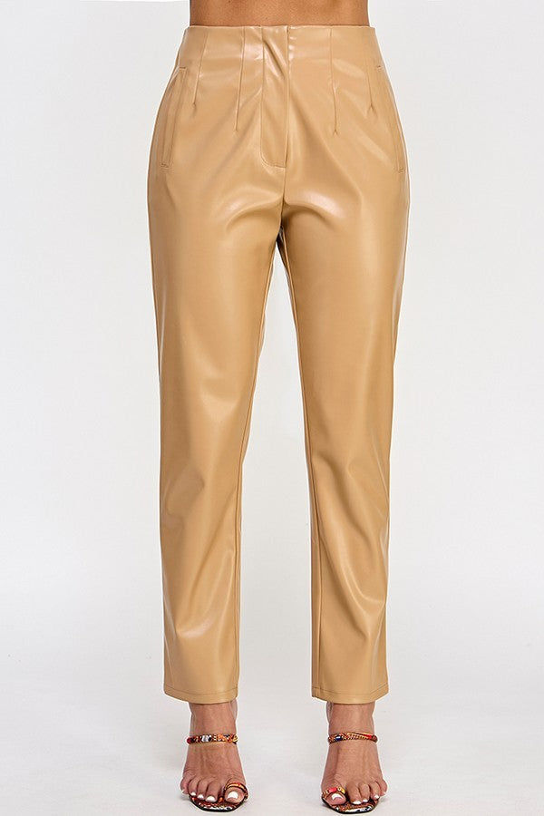 Chic beige faux leather pants displayed on a hanger, showcasing their sleek design and modern style.