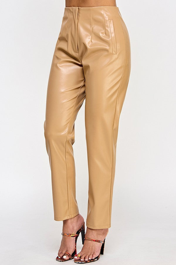 Chic beige faux leather pants displayed on a hanger, showcasing their sleek design and modern style.