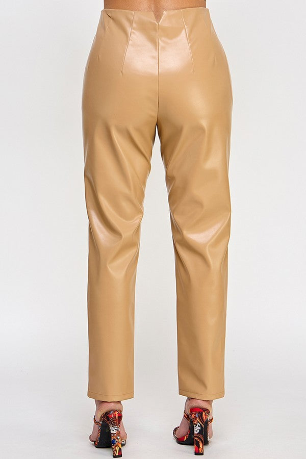 Chic beige faux leather pants displayed on a hanger, showcasing their sleek design and modern style.