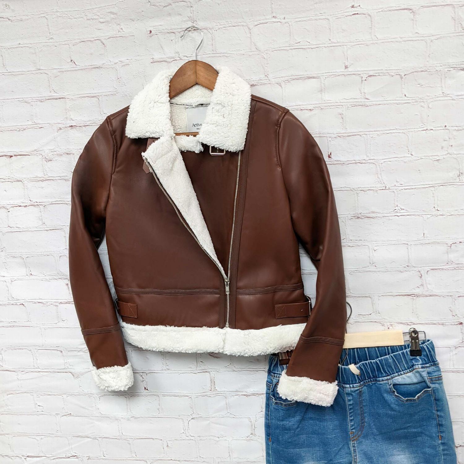 Faux Leather Shearling Jacket featuring asymmetrical zipper and belted waistband, perfect for stylish layering.