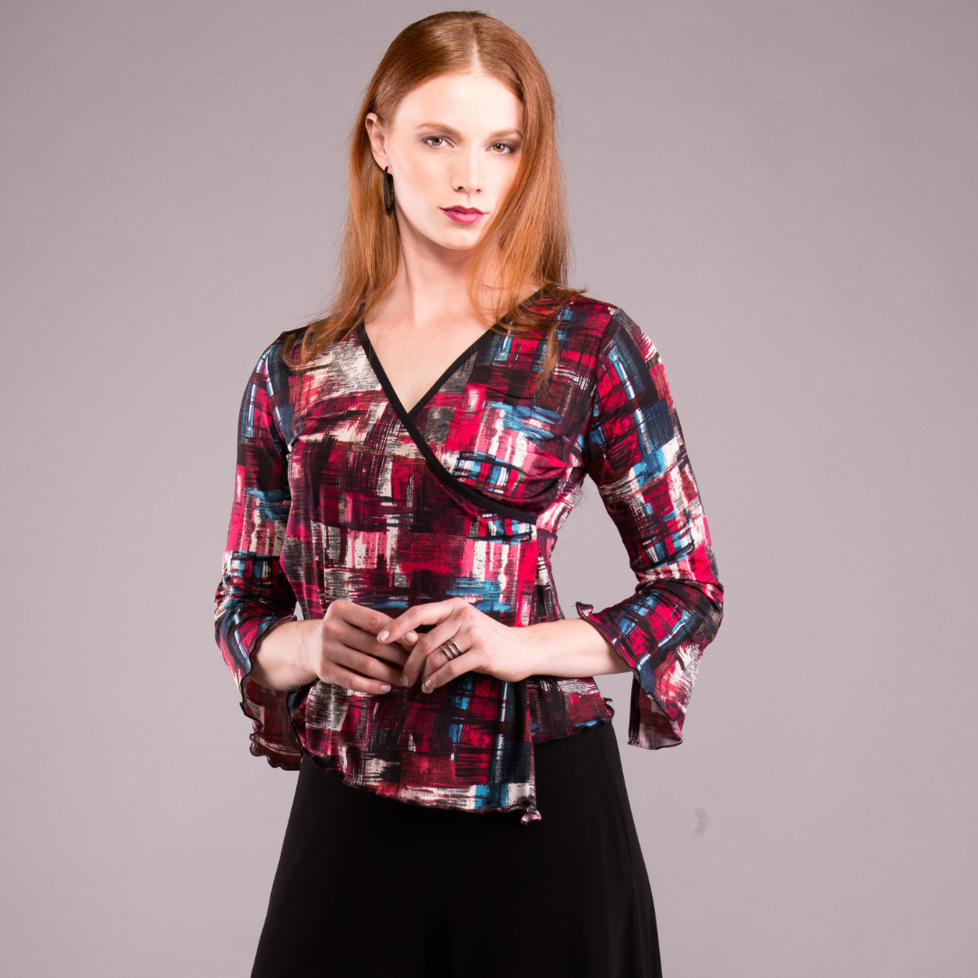 A stylish Faux Wrap Blouse in a versatile color, showcasing its elegant design and comfortable fit.