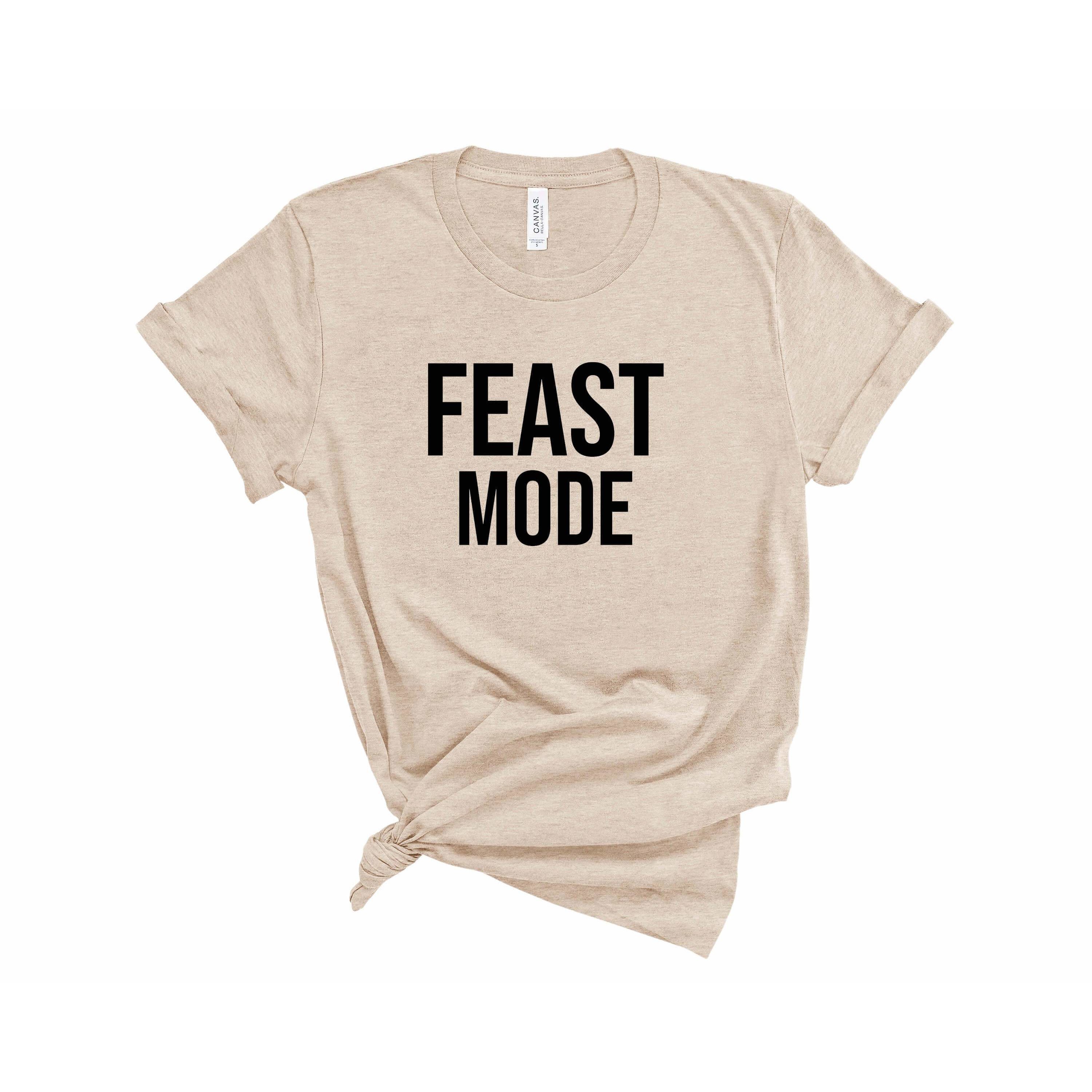 A stylish unisex Feast Mode Tee featuring a vibrant food-themed design, perfect for food lovers.