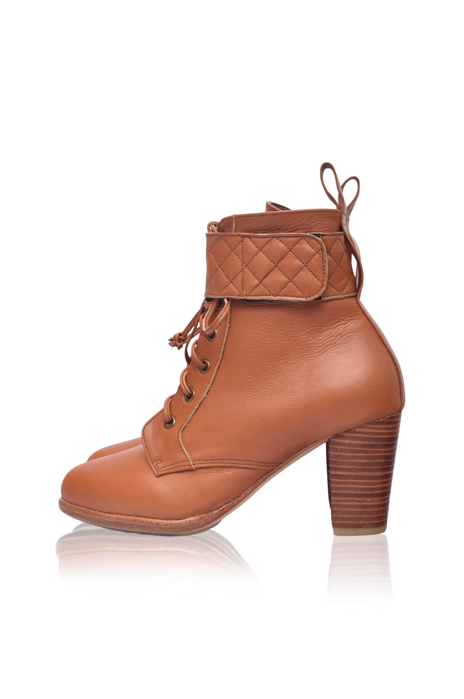 Fine Lover leather booties featuring a lace-up design, chunky wooden heel, and smooth leather finish, perfect for stylish outfits.