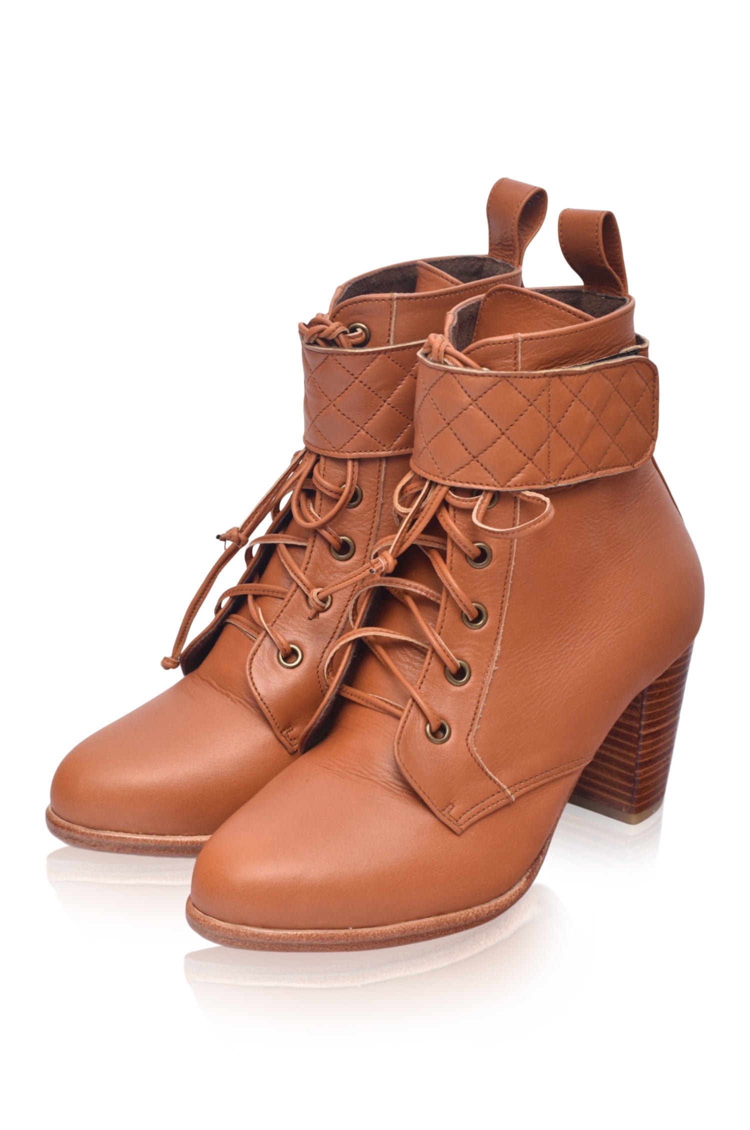 Fine Lover leather booties featuring a lace-up design, chunky wooden heel, and smooth leather finish, perfect for stylish outfits.