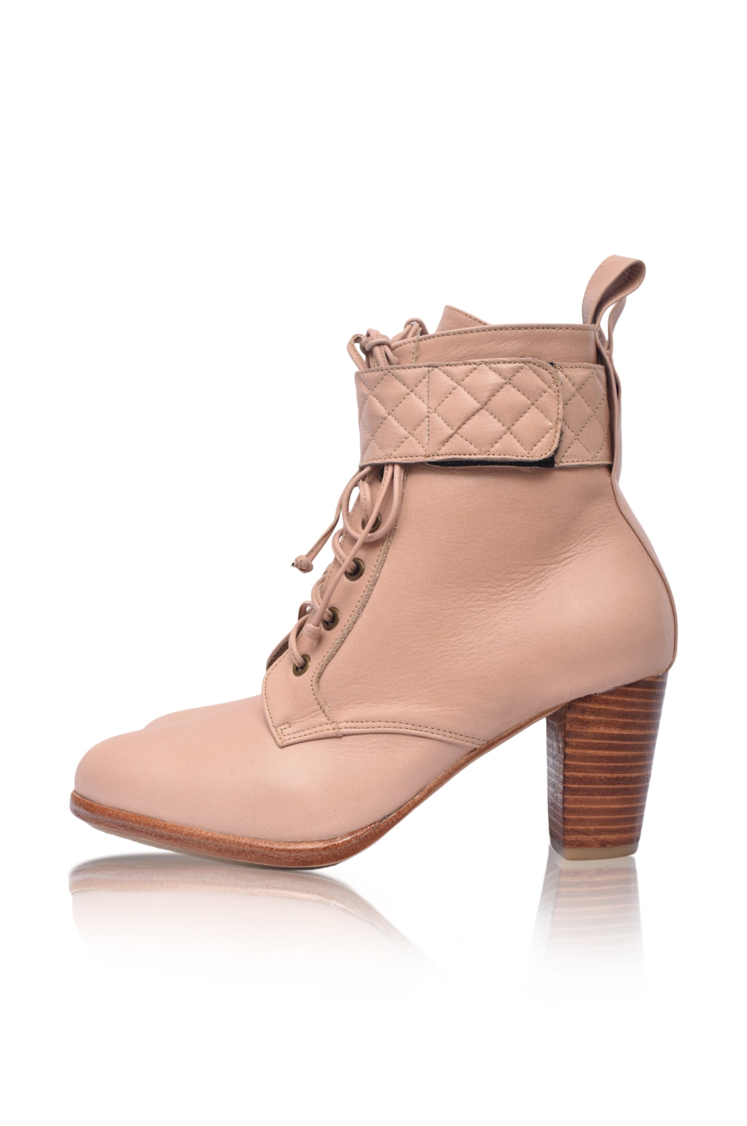 Fine Lover leather booties featuring a lace-up design, chunky wooden heel, and smooth leather finish, perfect for stylish outfits.