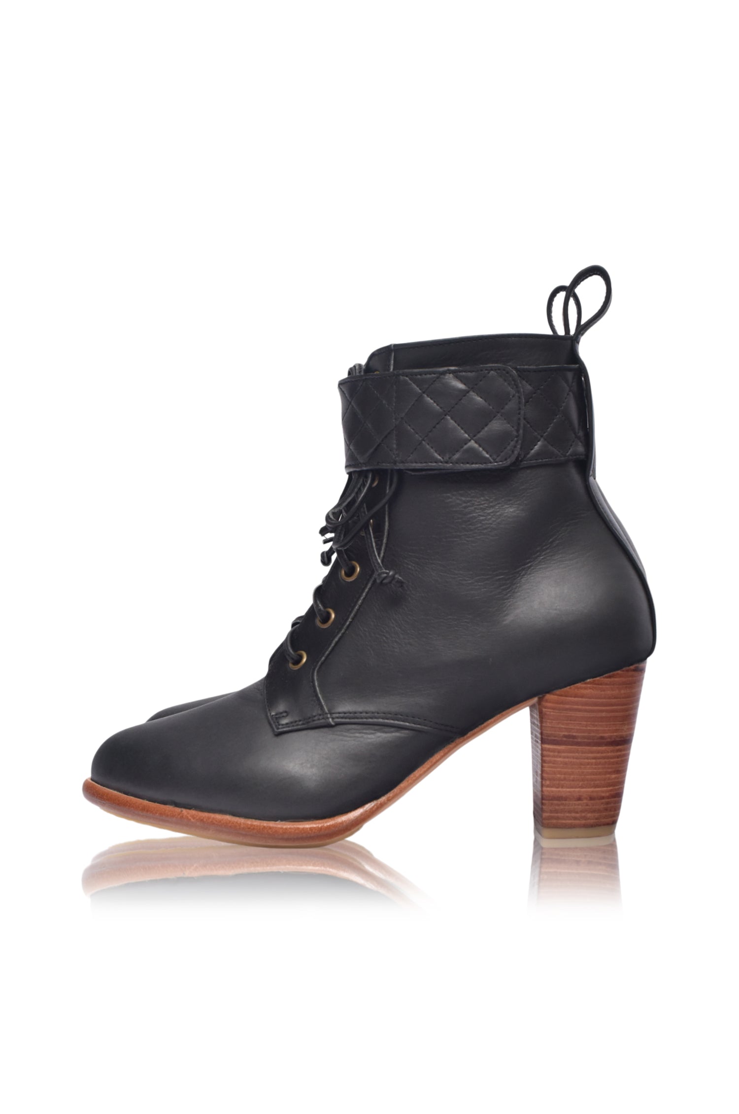 Fine Lover leather booties featuring a lace-up design, chunky wooden heel, and smooth leather finish, perfect for stylish outfits.