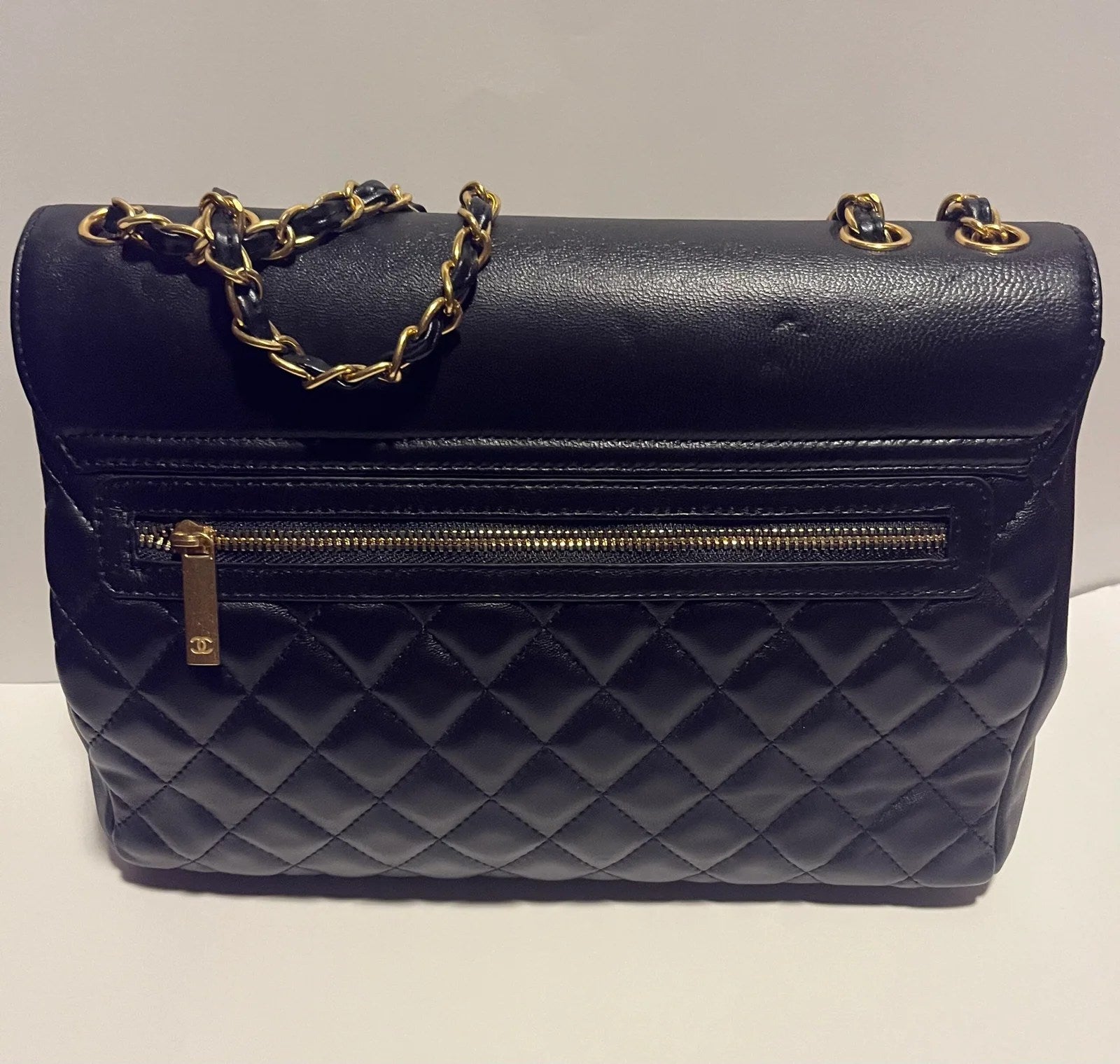 Flap with Top Black Lux Bag featuring gold CC clasp and spacious interior design.