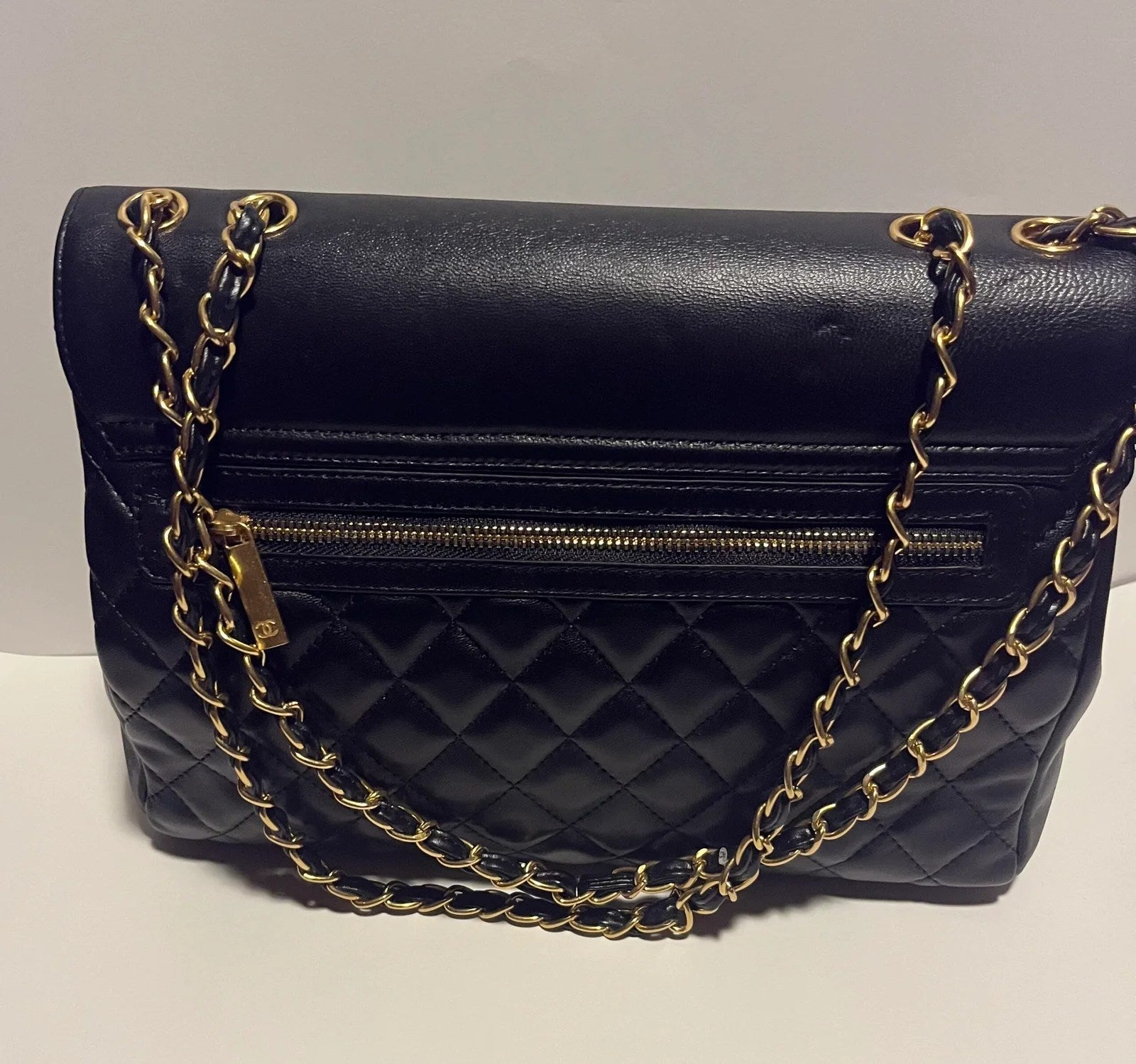 Flap with Top Black Lux Bag featuring gold CC clasp and spacious interior design.