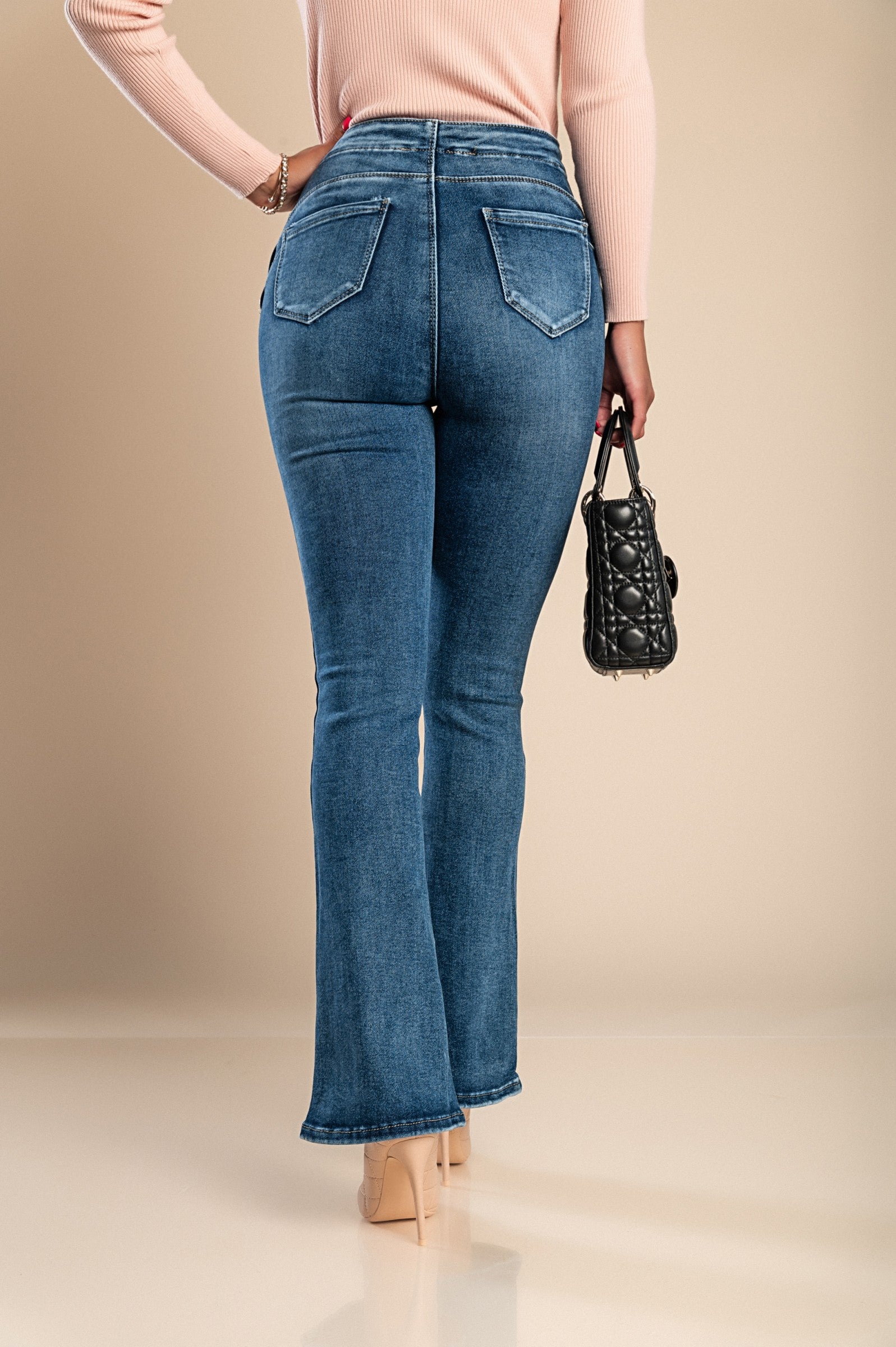 Flared jeans Bera in blue featuring decorative buttons and back pockets, made from high-quality elastic fabric.