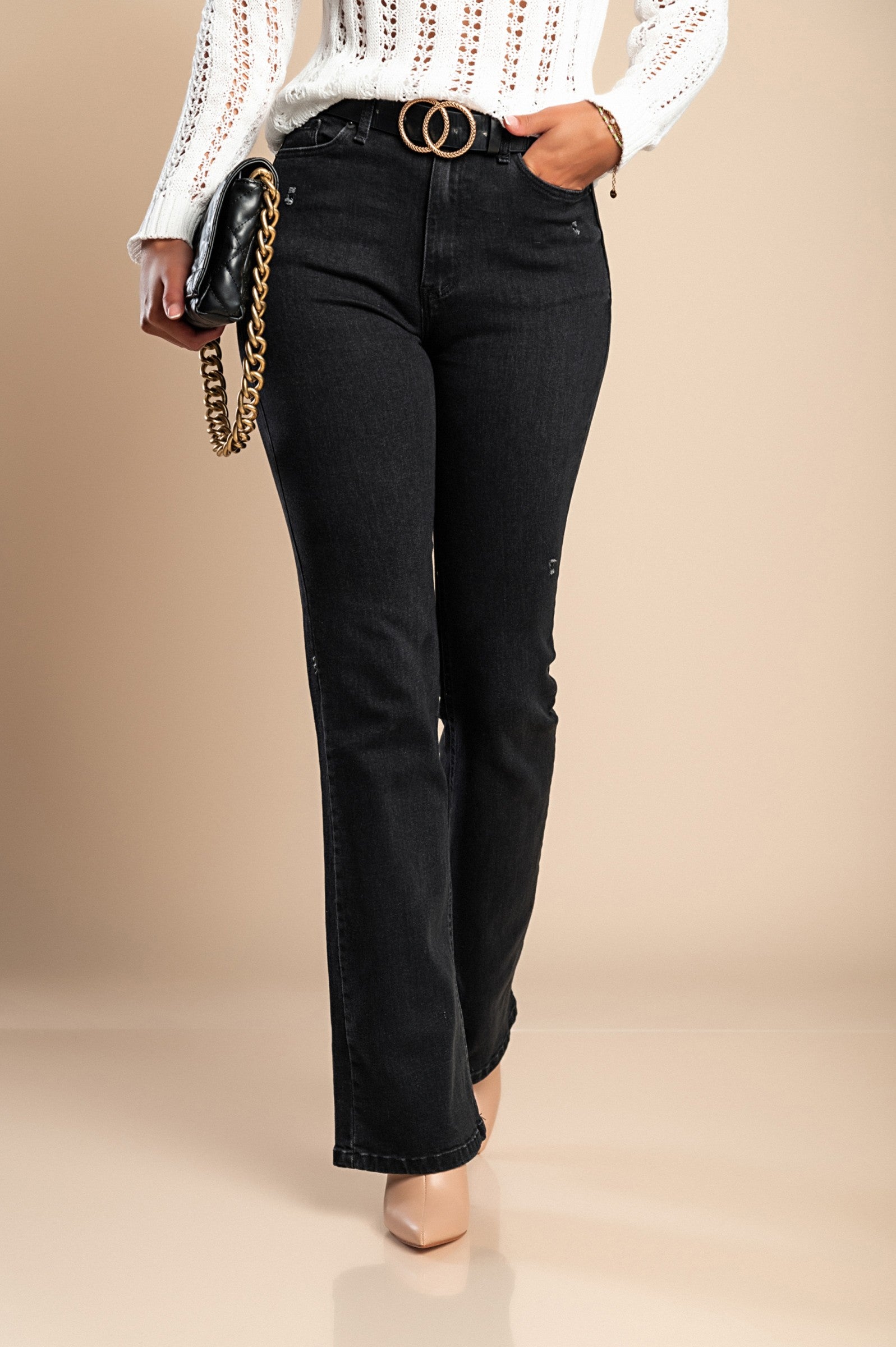 A pair of stylish black flared jeans featuring a high waist, front and back pockets, and a zip and button closure.