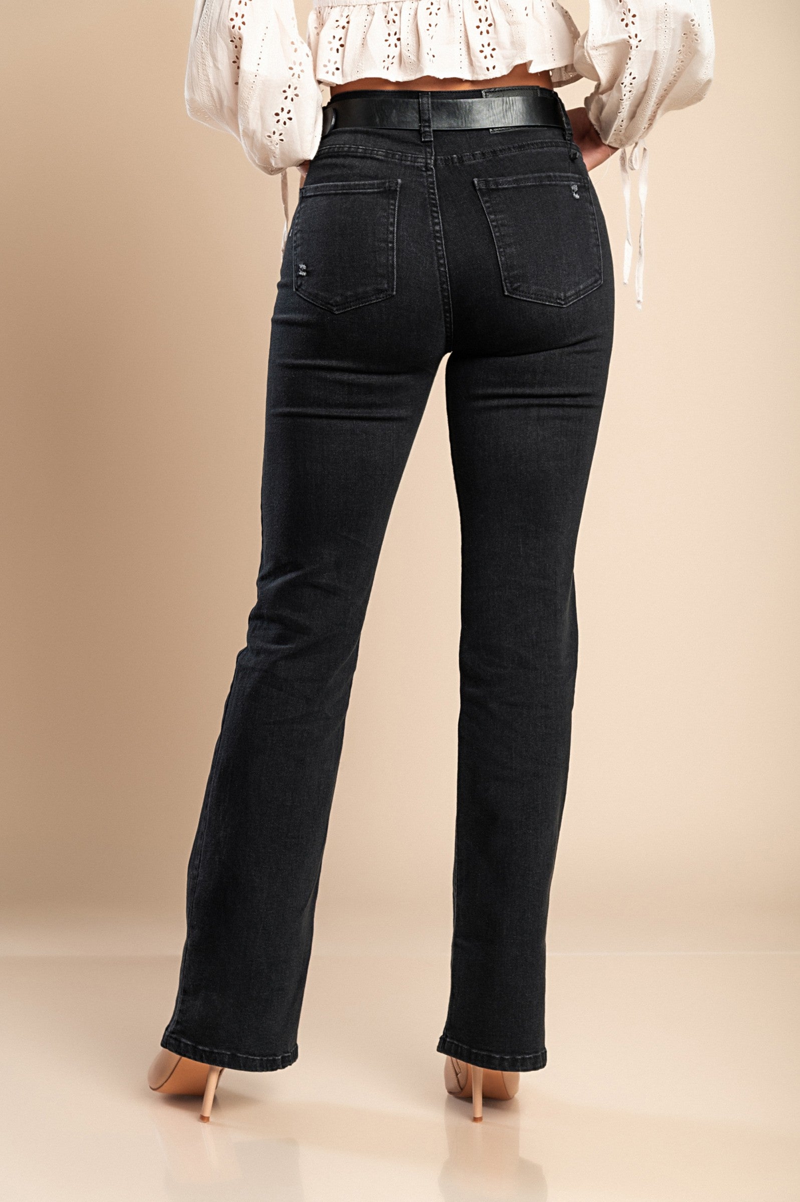 Stylish black flared jeans made from high-quality cotton, featuring a high waist, flared legs, and front and back pockets.