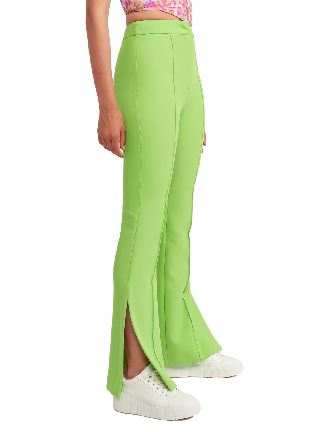 A pair of stylish flared trousers with slits on the sides, made from a comfortable blend of polyester, viscose, and elastane, displayed on a mannequin.