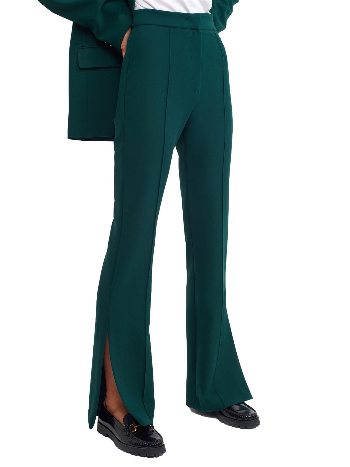 A pair of stylish flared trousers with slits on the sides, made from a comfortable blend of polyester, viscose, and elastane, displayed on a mannequin.